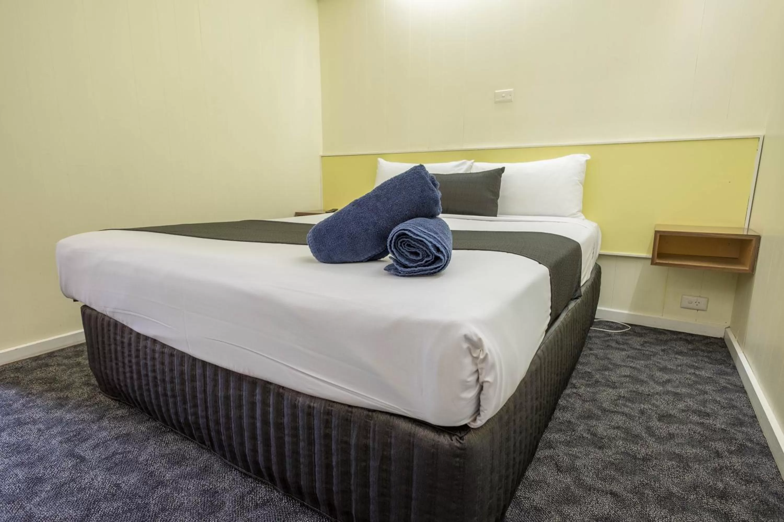 Bed in Pioneer Station Motor Inn