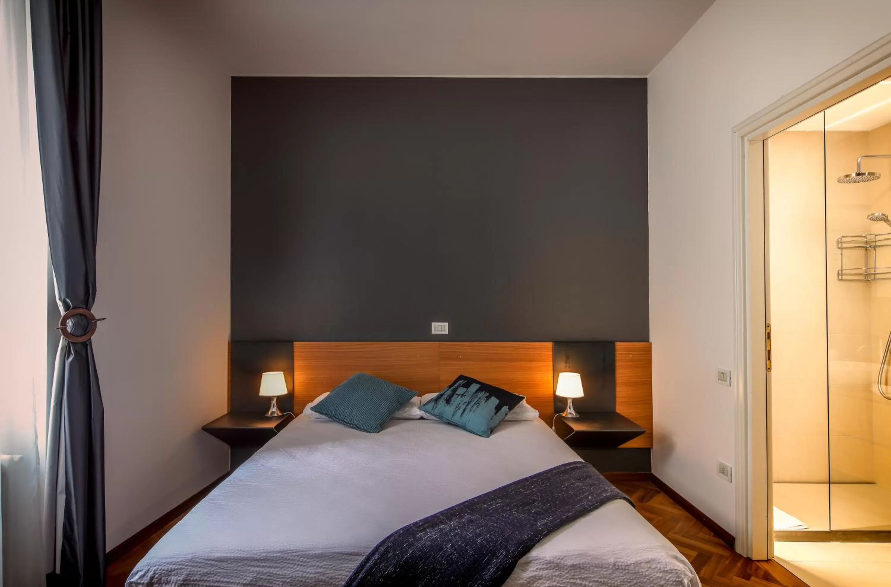 Bed in Lainez Rooms & Suites