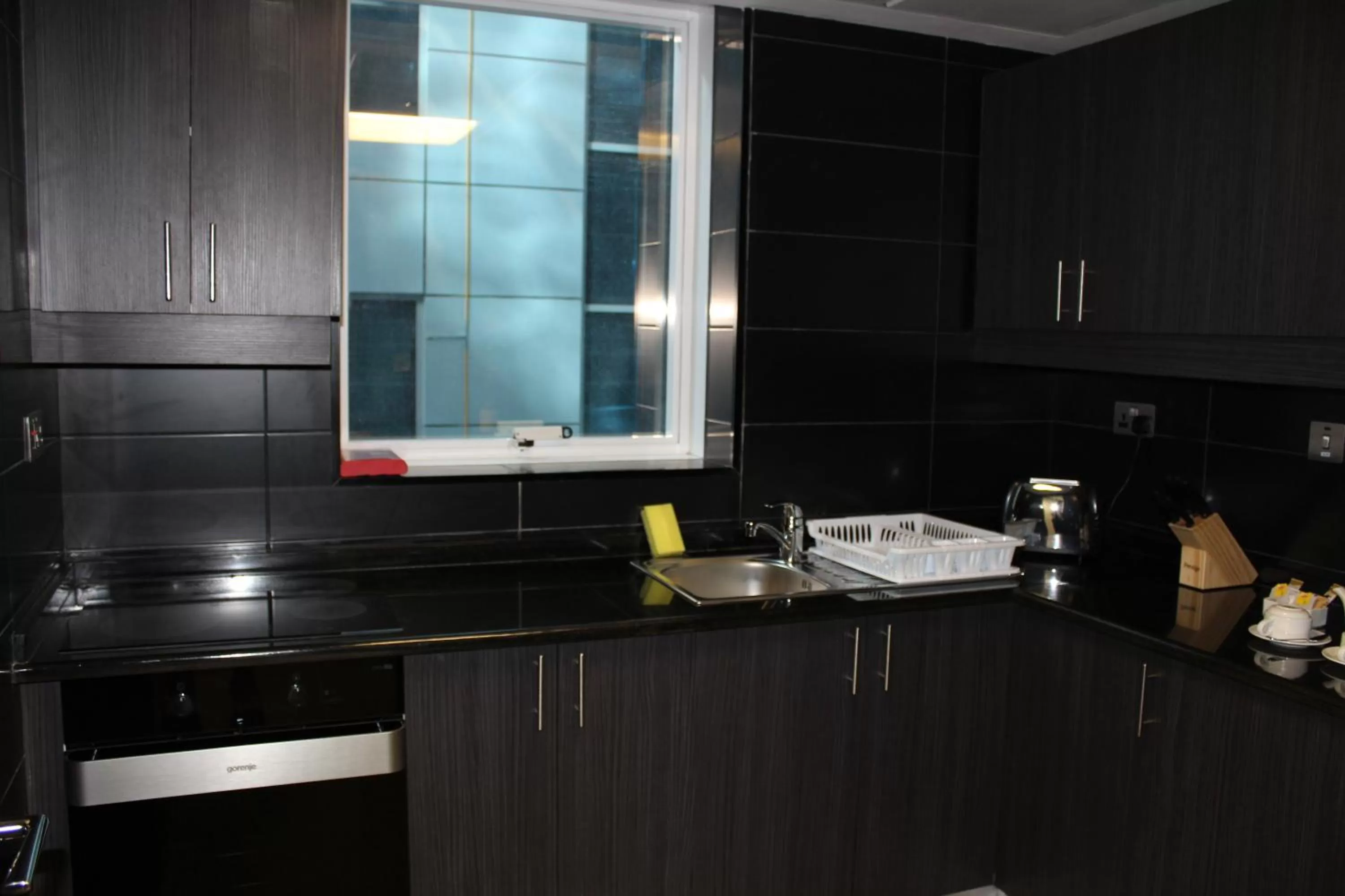 Kitchen or kitchenette in Al Diar Sawa Hotel Apartments
