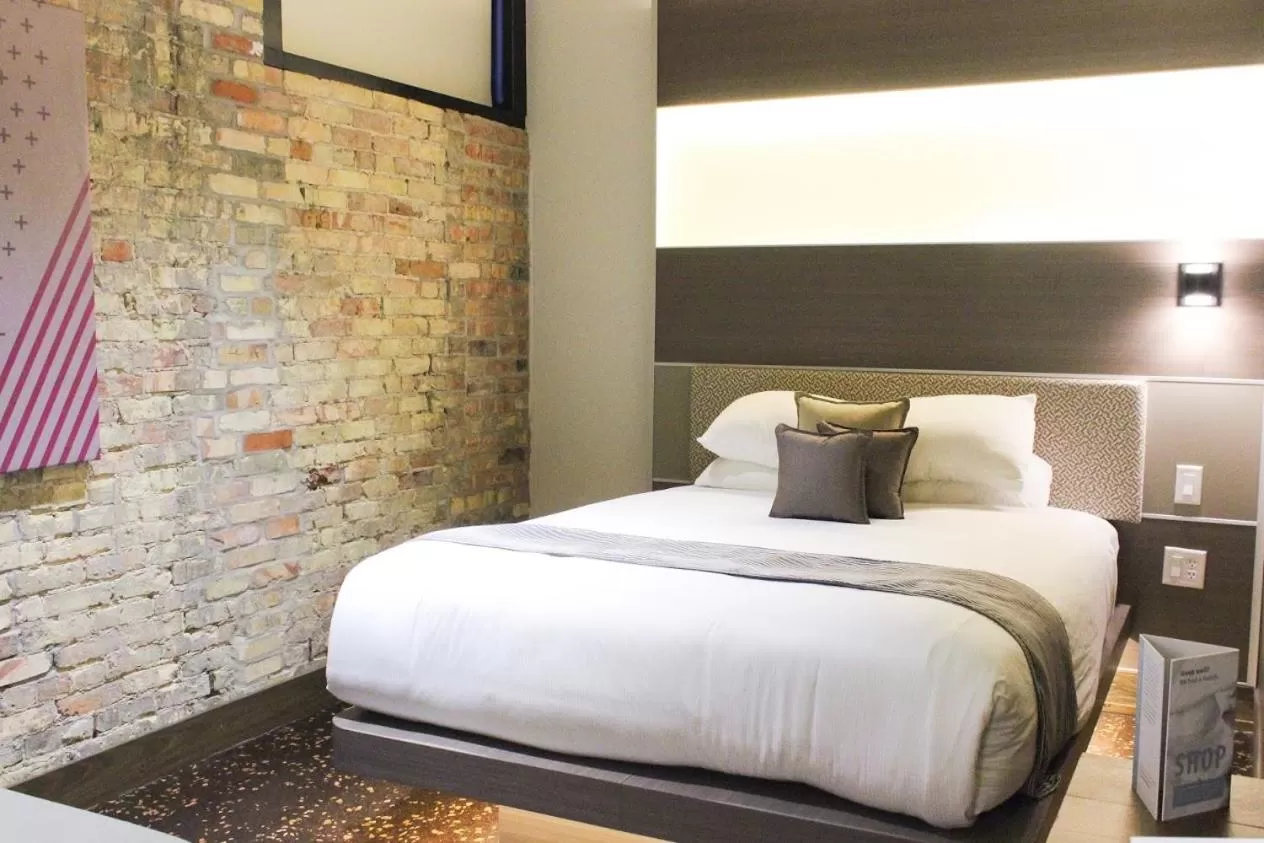 Bed in CityFlatsHotel - Grand Rapids, an Ascend Collection Hotel