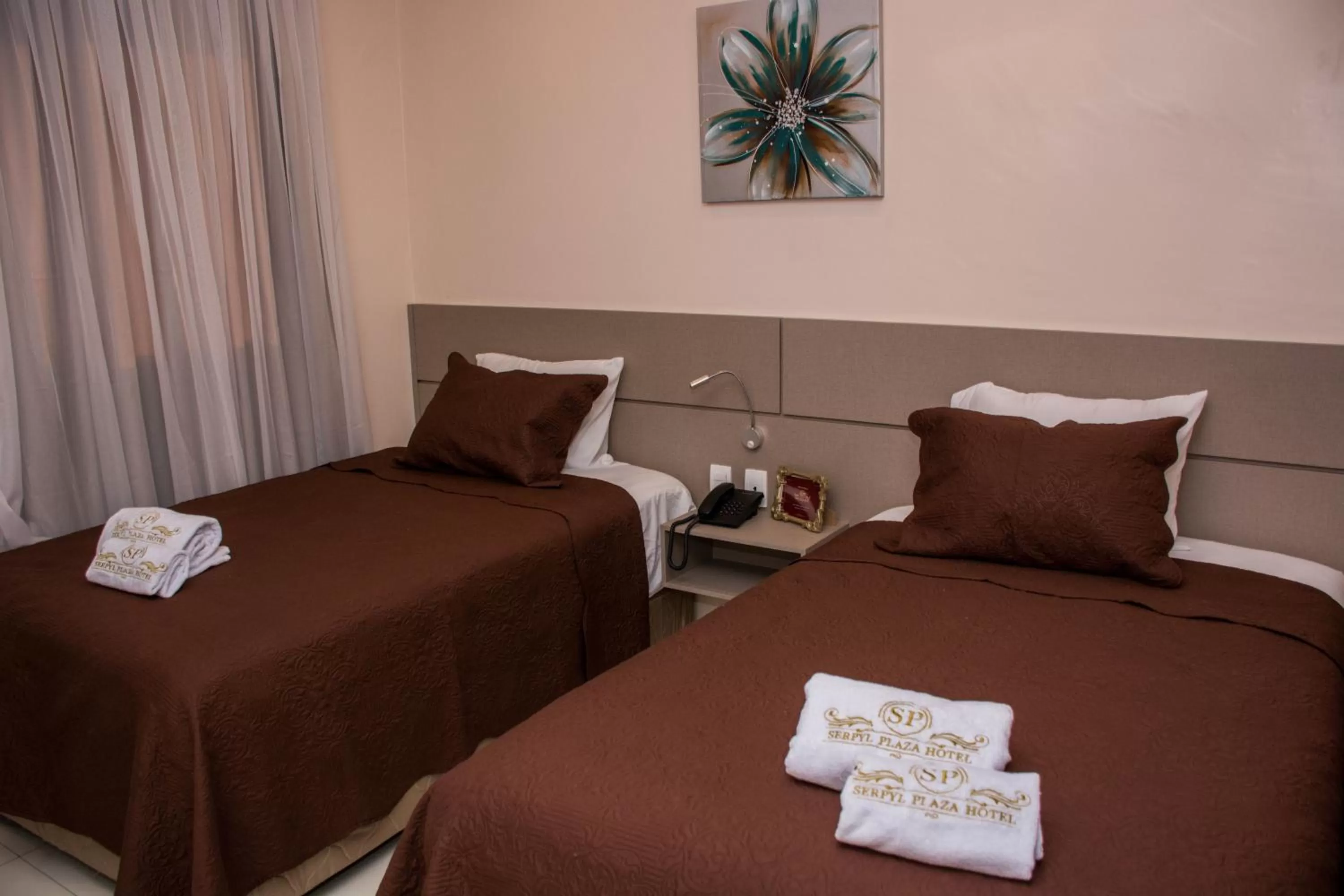 Bed in SERPYL Plaza Hotel