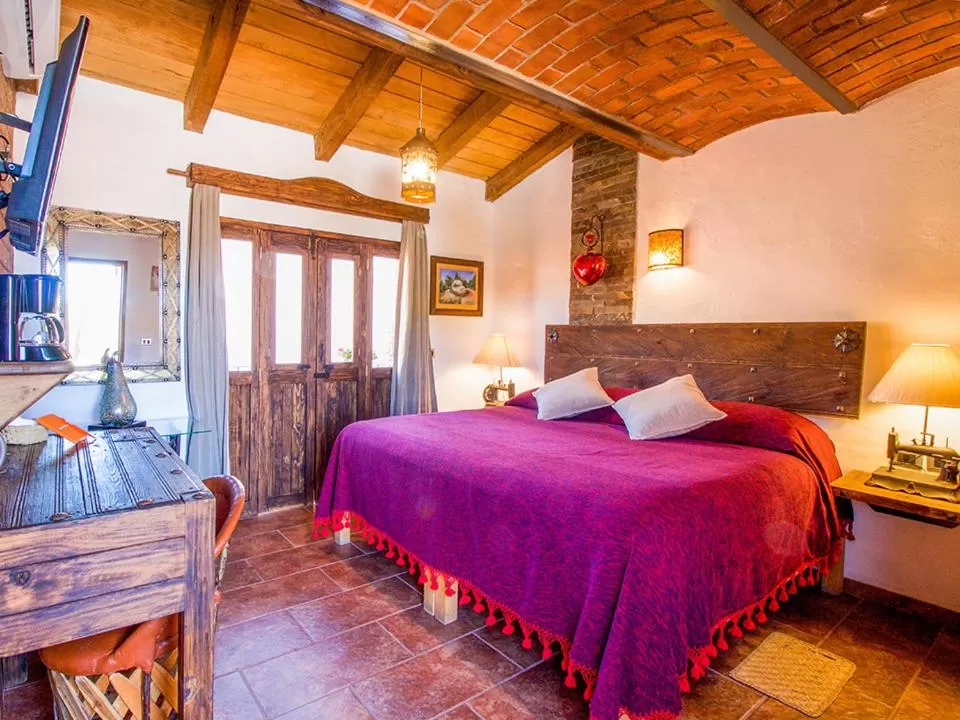 Photo of the whole room, Bed in Hotel Mi Pueblito Tapalpa