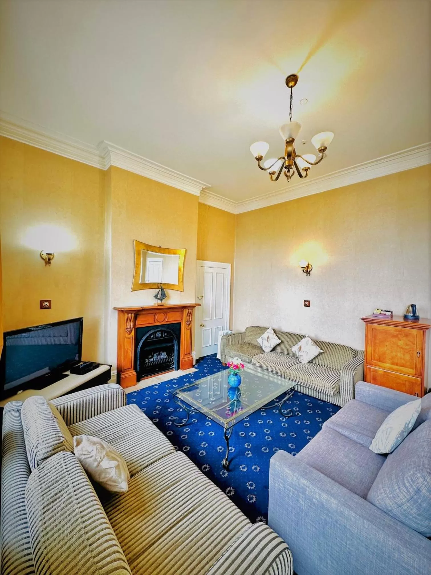 Living room, Bed in The Esplanade Hotel