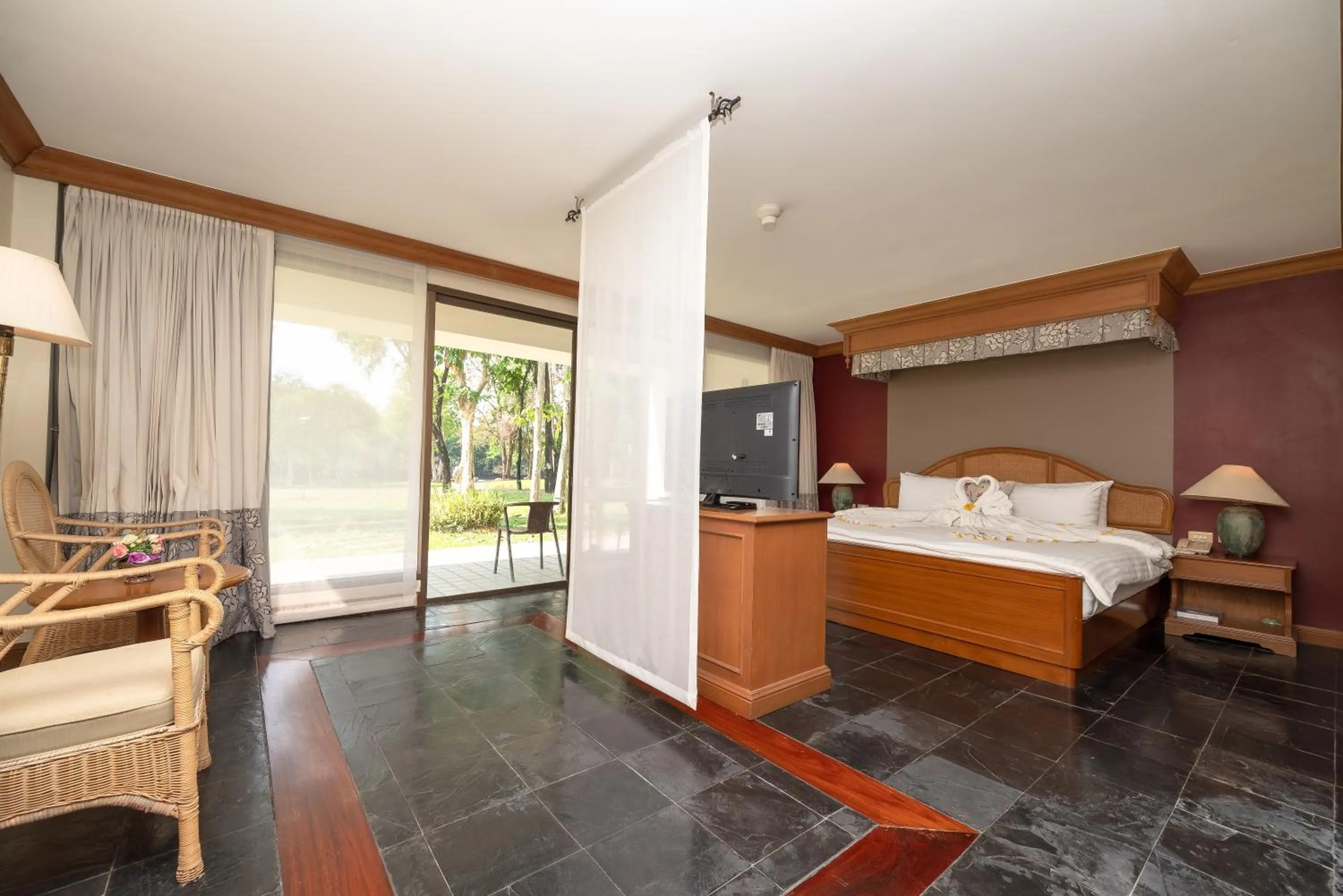 Bed in Comsaed River Kwai Resort