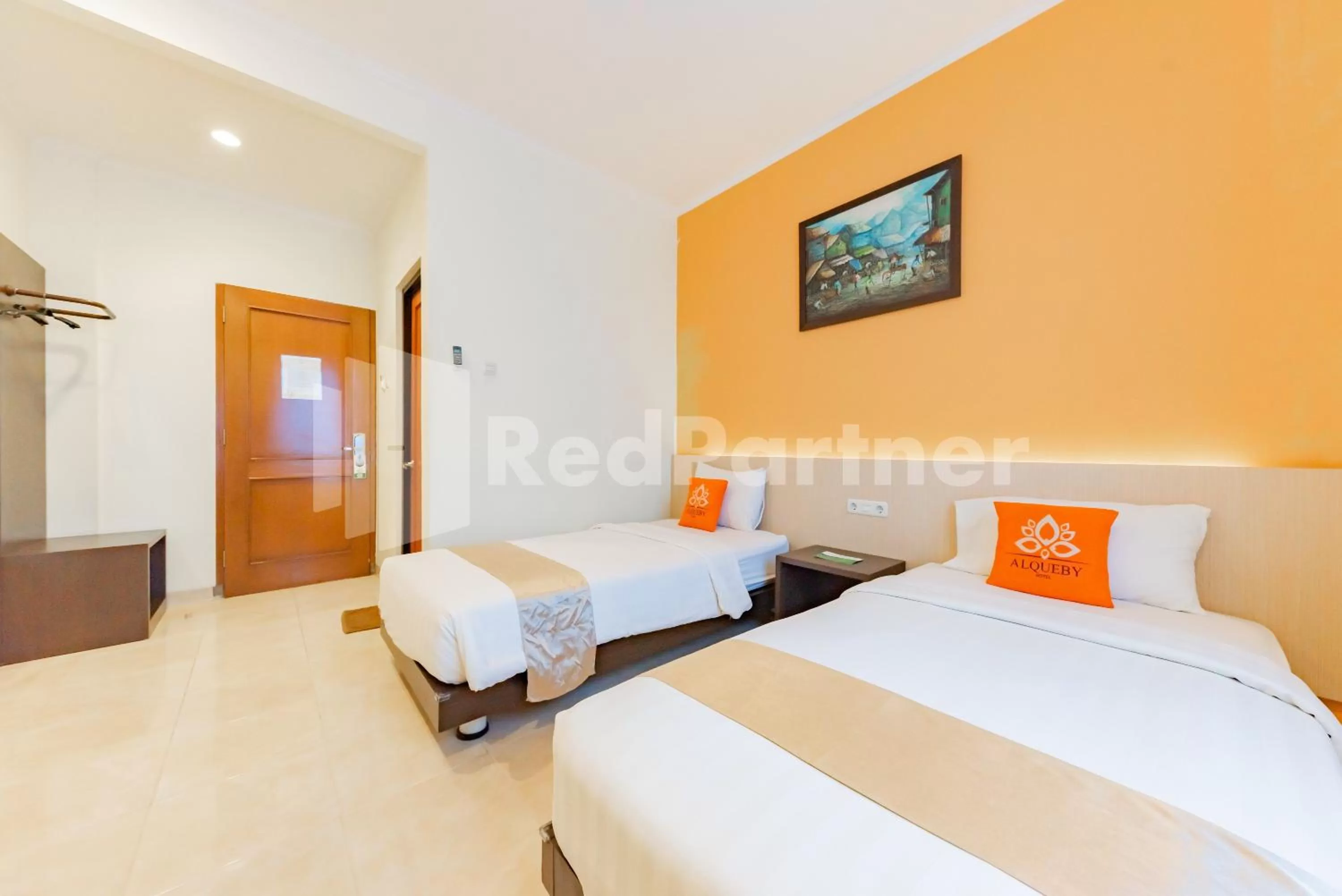 Bedroom, Bed in Alqueby Hotel near Kiara Artha Park & Trans Studio Mall Mitra RedDoorz