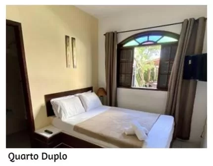 Photo of the whole room, Bed in Pousada Porto Búzios