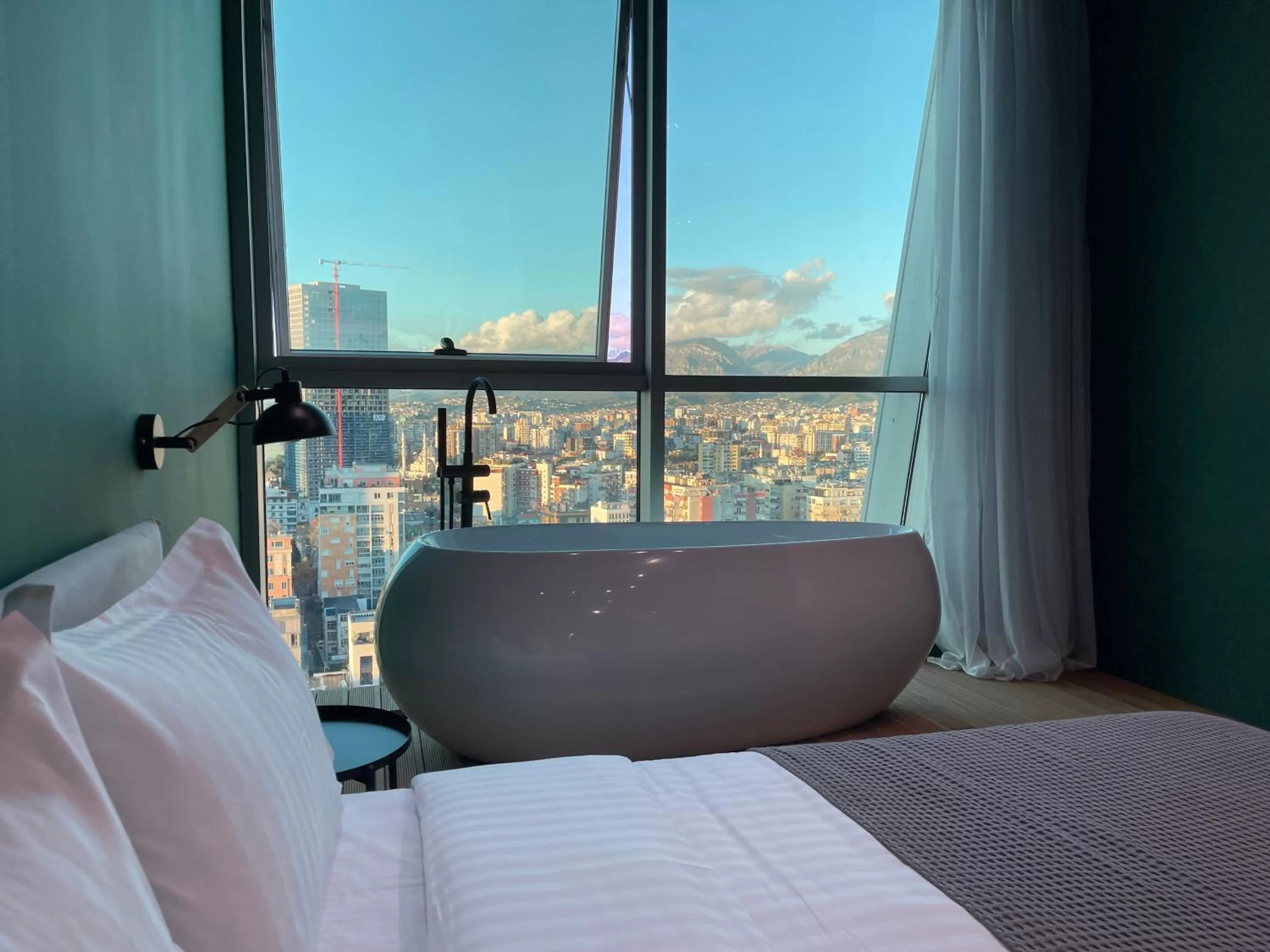 Bed in Ambassador Skyline Apartments