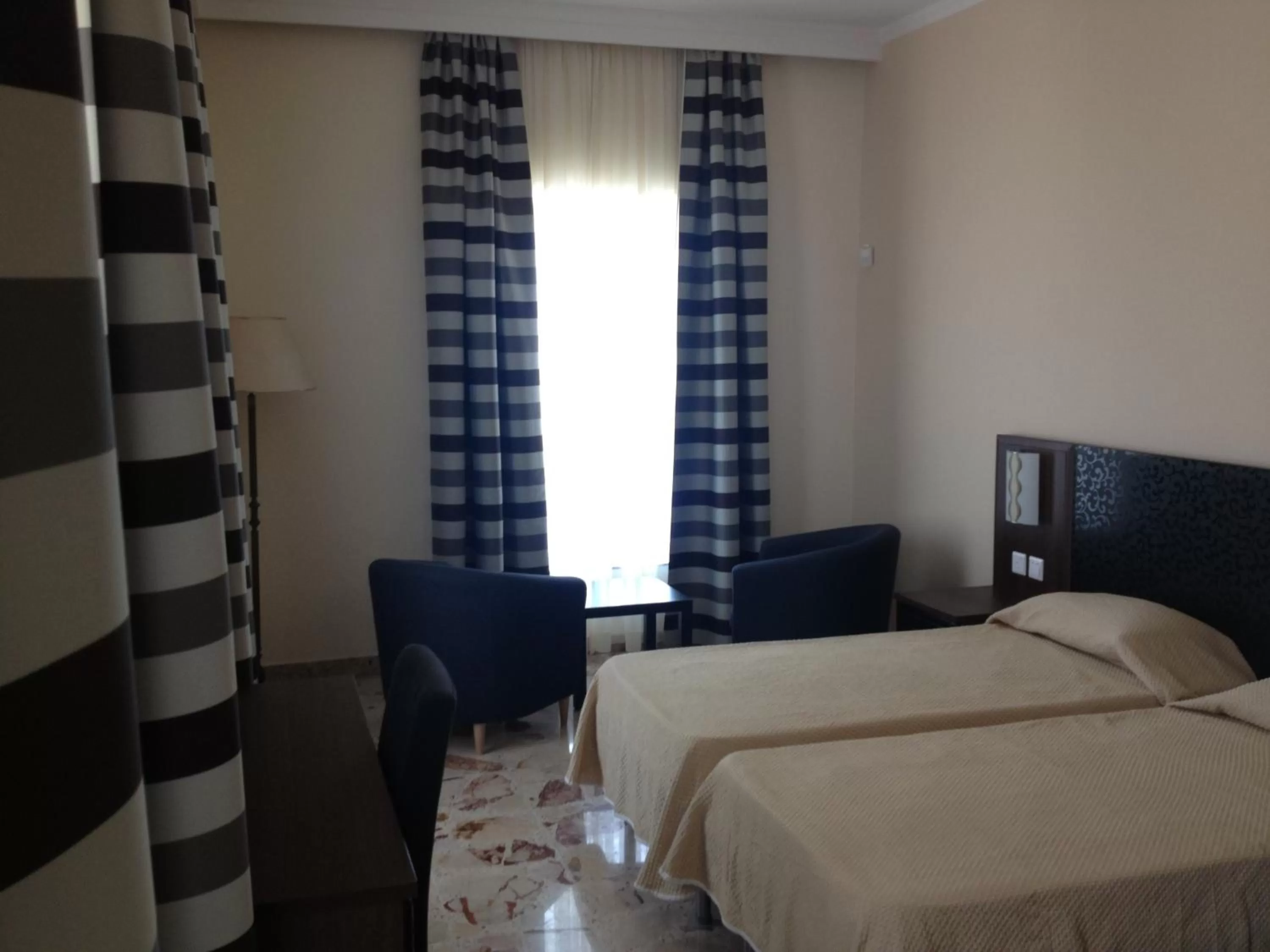 Bed in Grand Harbour Hotel