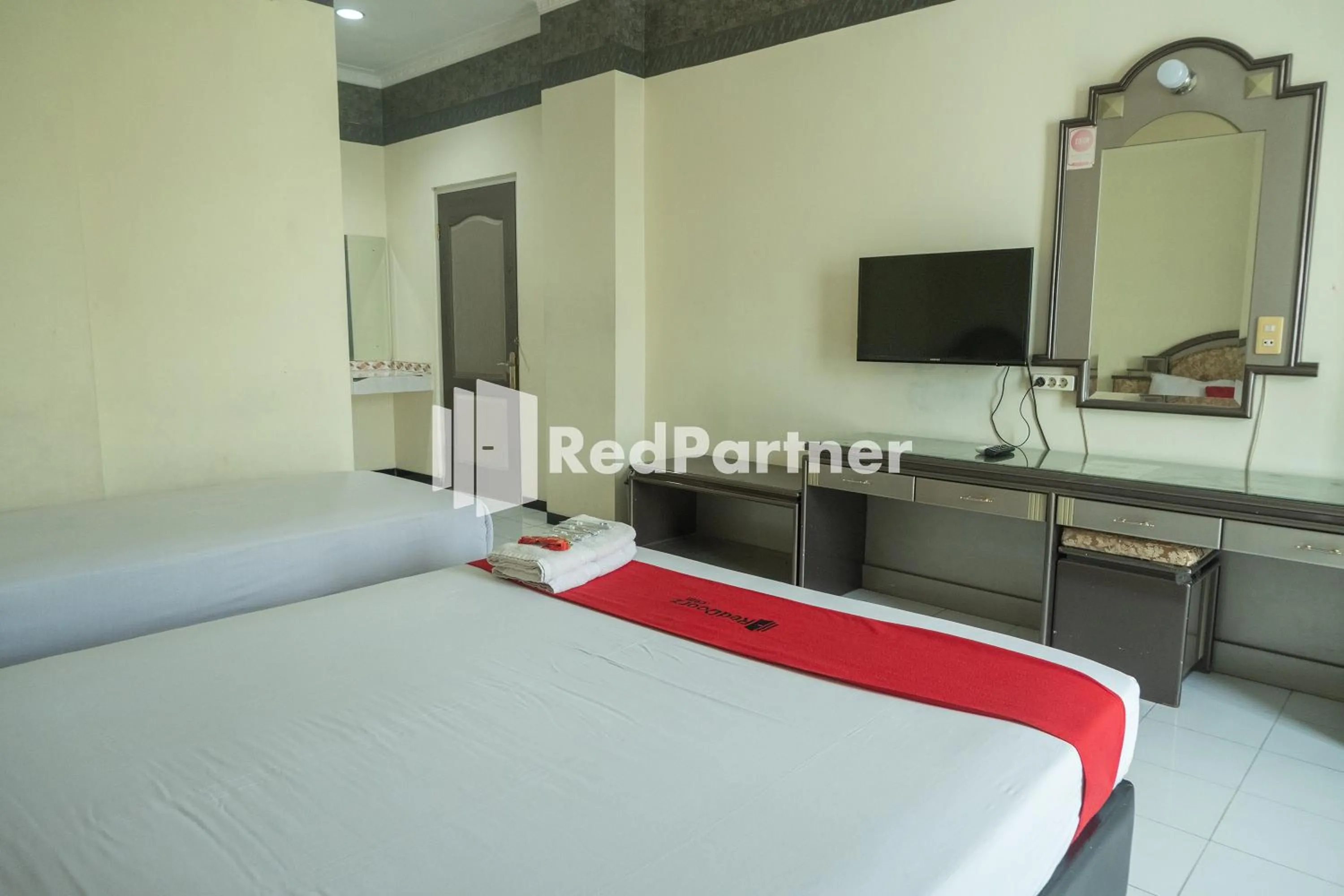 Bed in Akur Hotel Malioboro Mitra RedDoorz