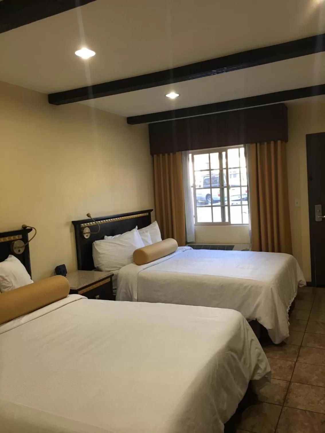 Bed in Tuscan Garden Inn