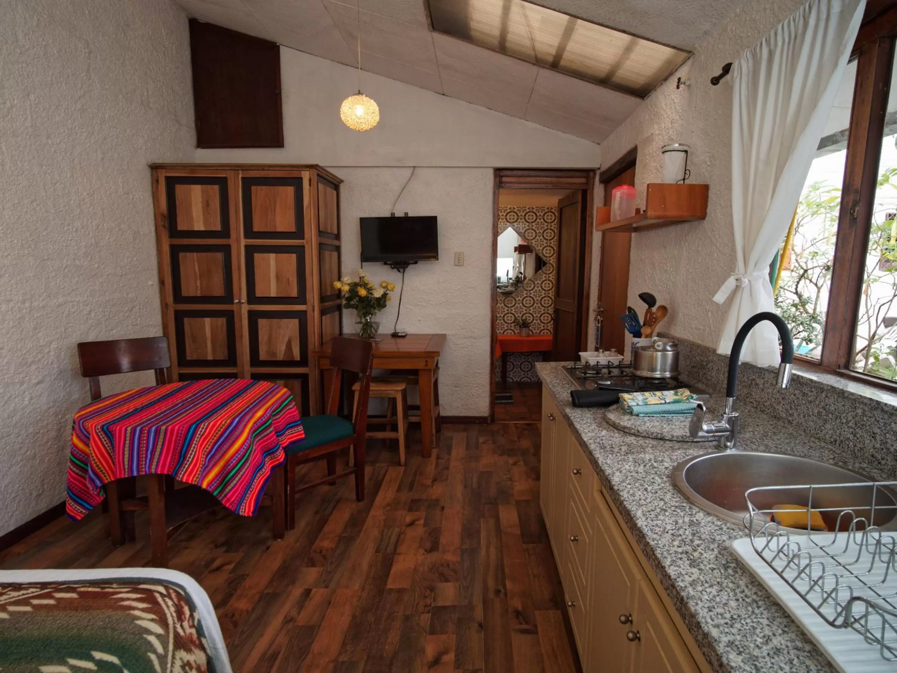 Living room, Kitchen/Kitchenette in Apartamentos Otorongo Cuenca Ecuador