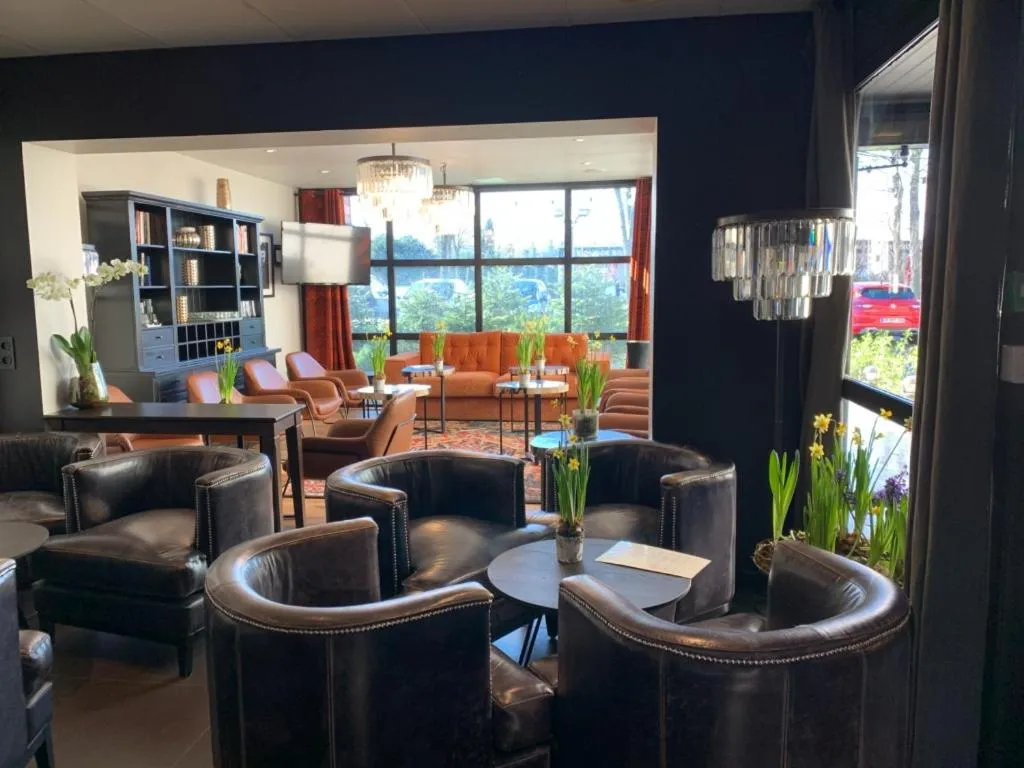 Living room in Hotel Acadie Eragny ( ex Comfort Hotel)