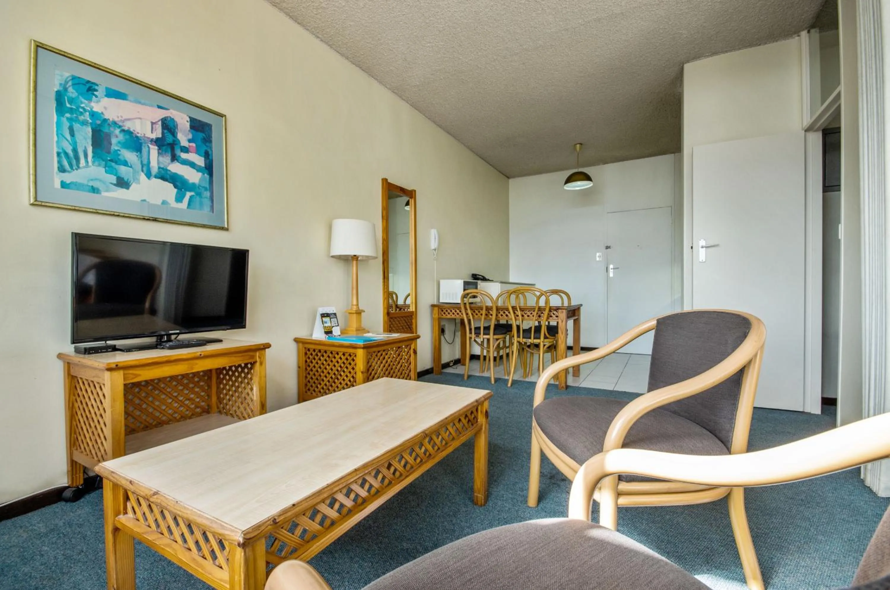 Seating area in Gardens Centre Holiday Apartments