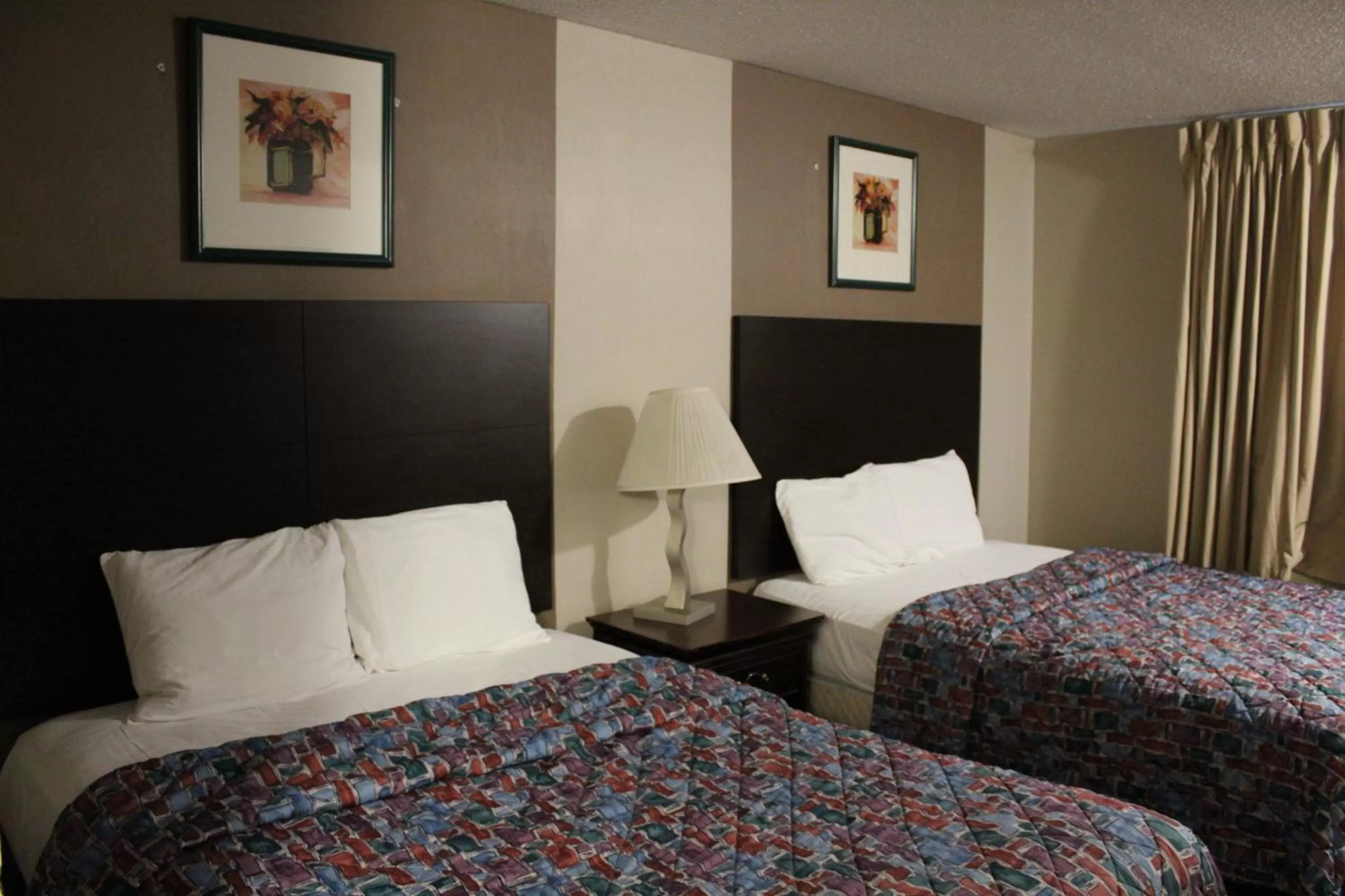 Bedroom, Bed in Coratel Inn and Suites Maple Grove