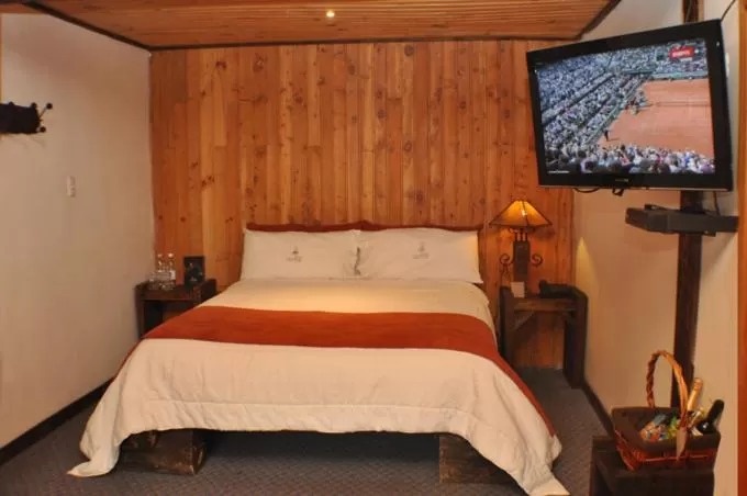 Bed in Hacienda Hostería Dos Chorreras