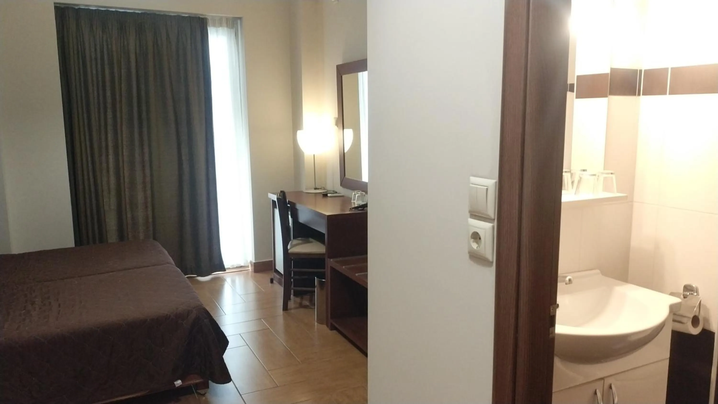 Bed in Ambrosia Suites