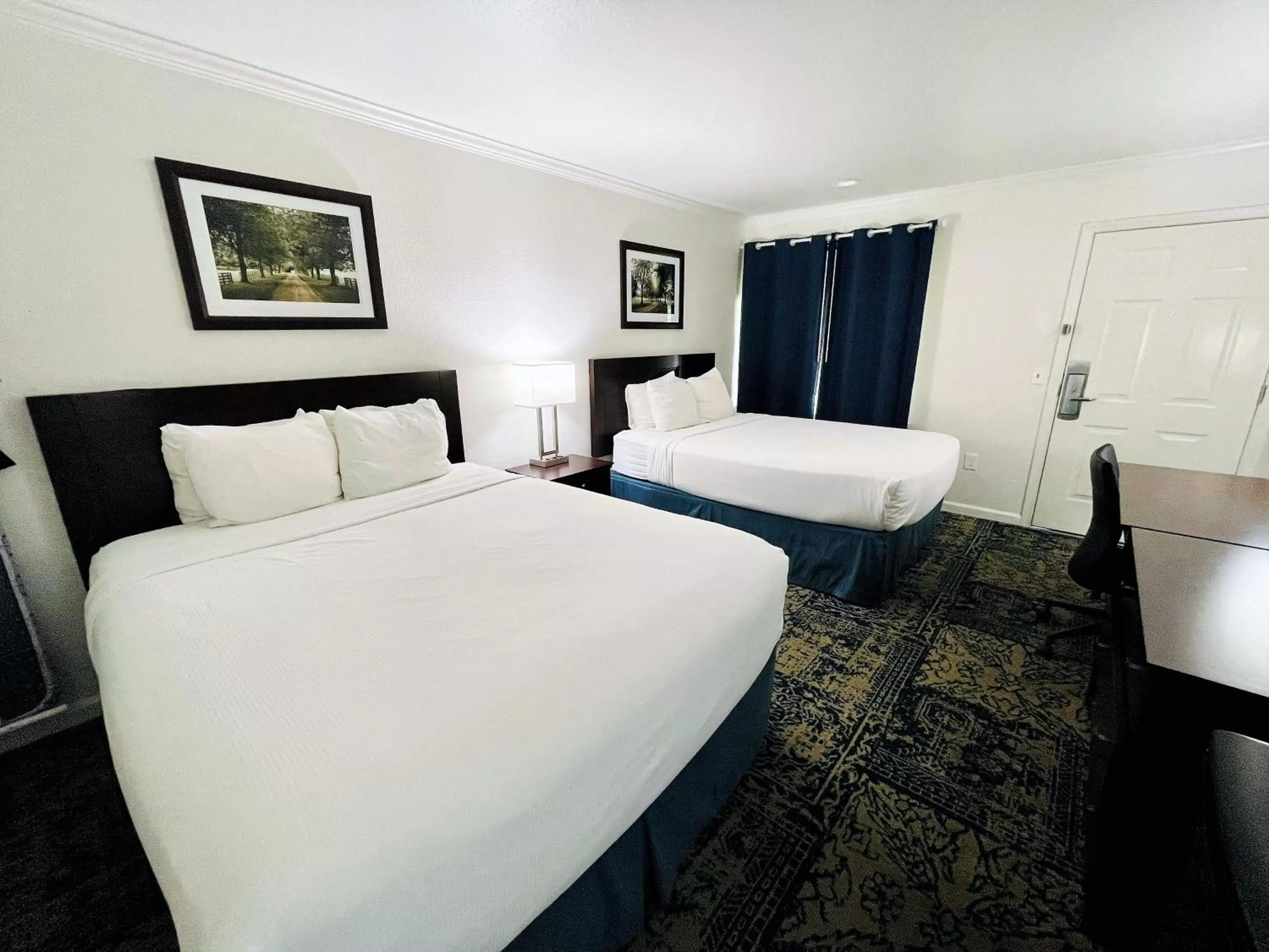 Standard Queen Room with Two Queen Beds in University Park Inn & Suites, an Ascend Collection Hotel