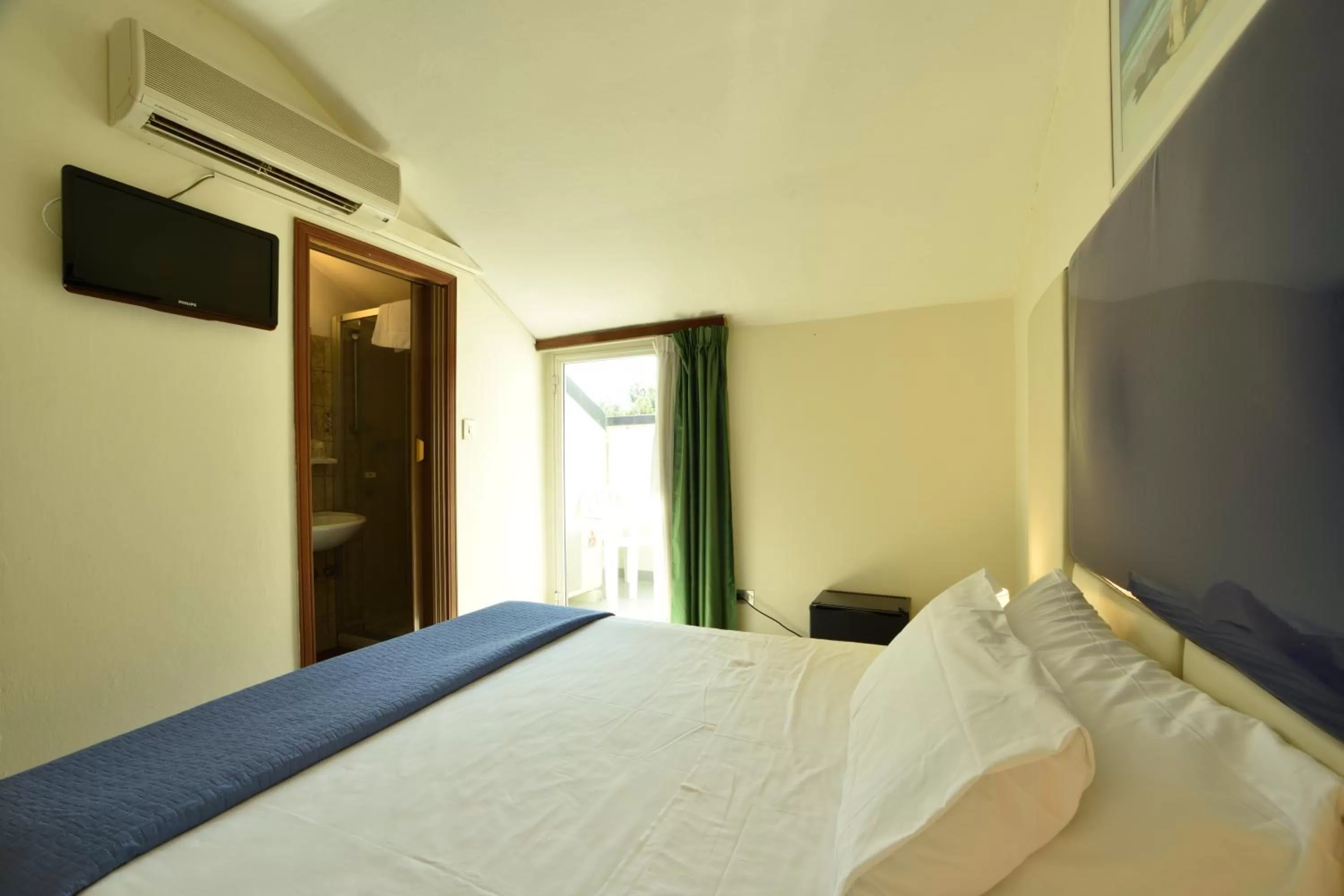 Photo of the whole room, Bed in Hotel Diano Marina Mhotelsgroup