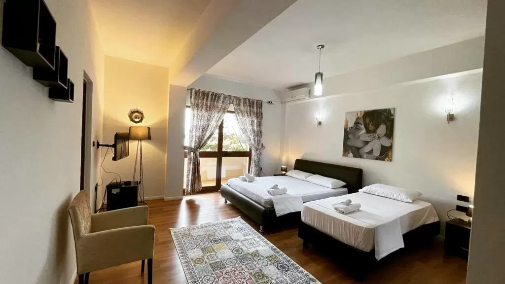 Bed in Hotel Ambasador Garden