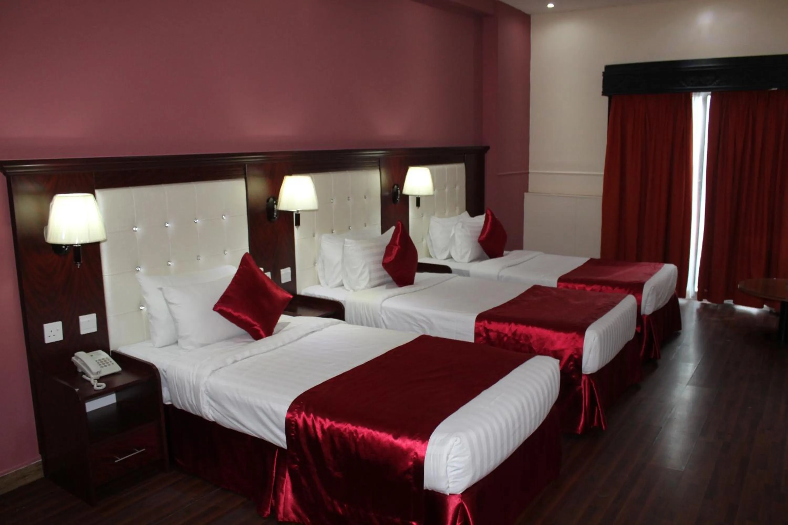 Bed in Grand Nova Hotel