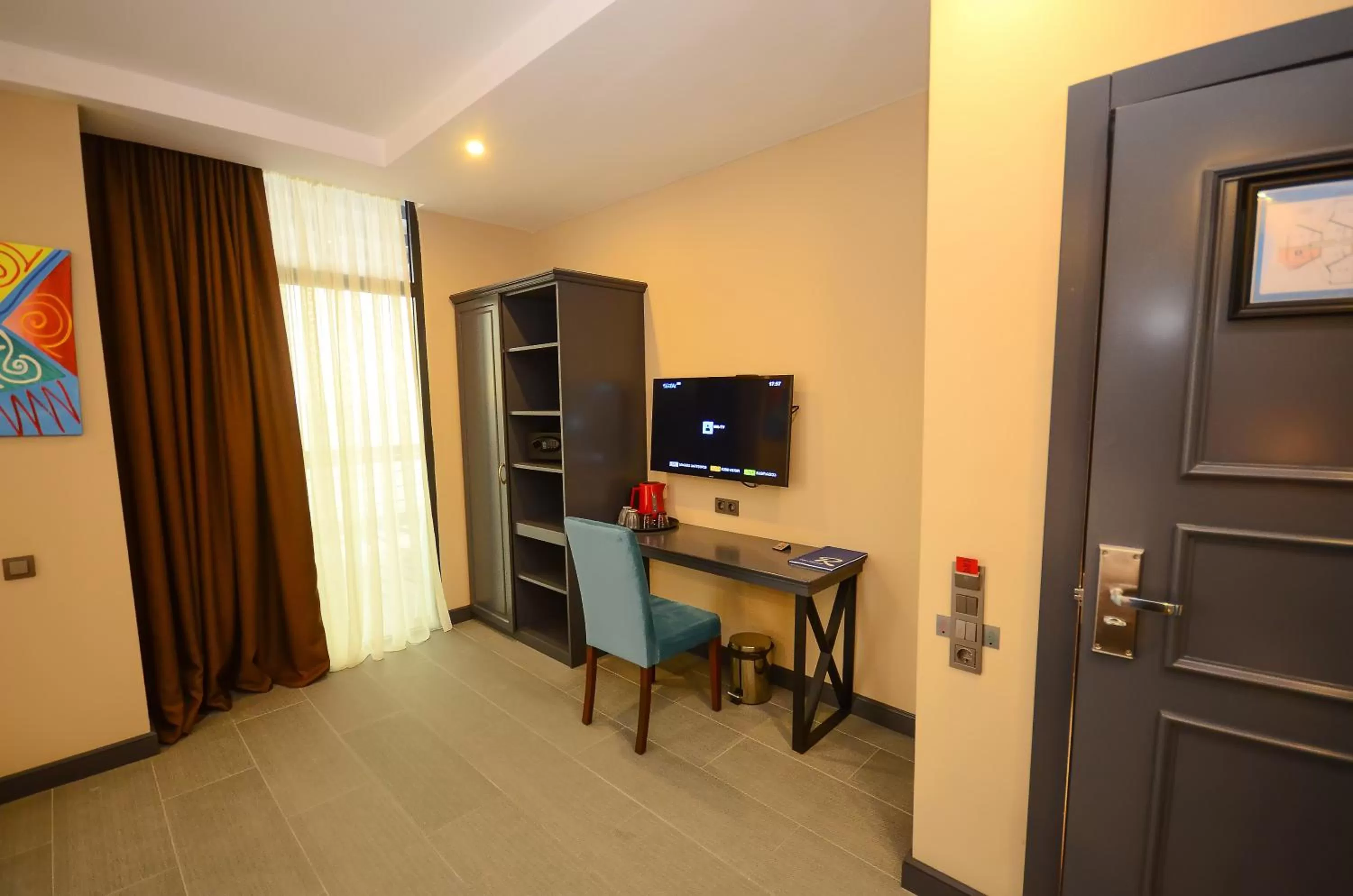 Communal lounge/ TV room, TV/Entertainment Center in Batumi Palm Hotel