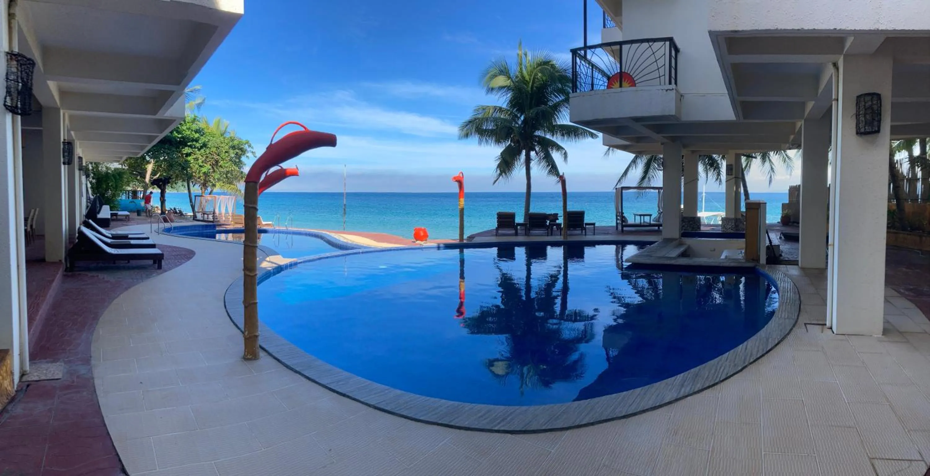 Swimming Pool in Sunset At Aninuan Beach Resort