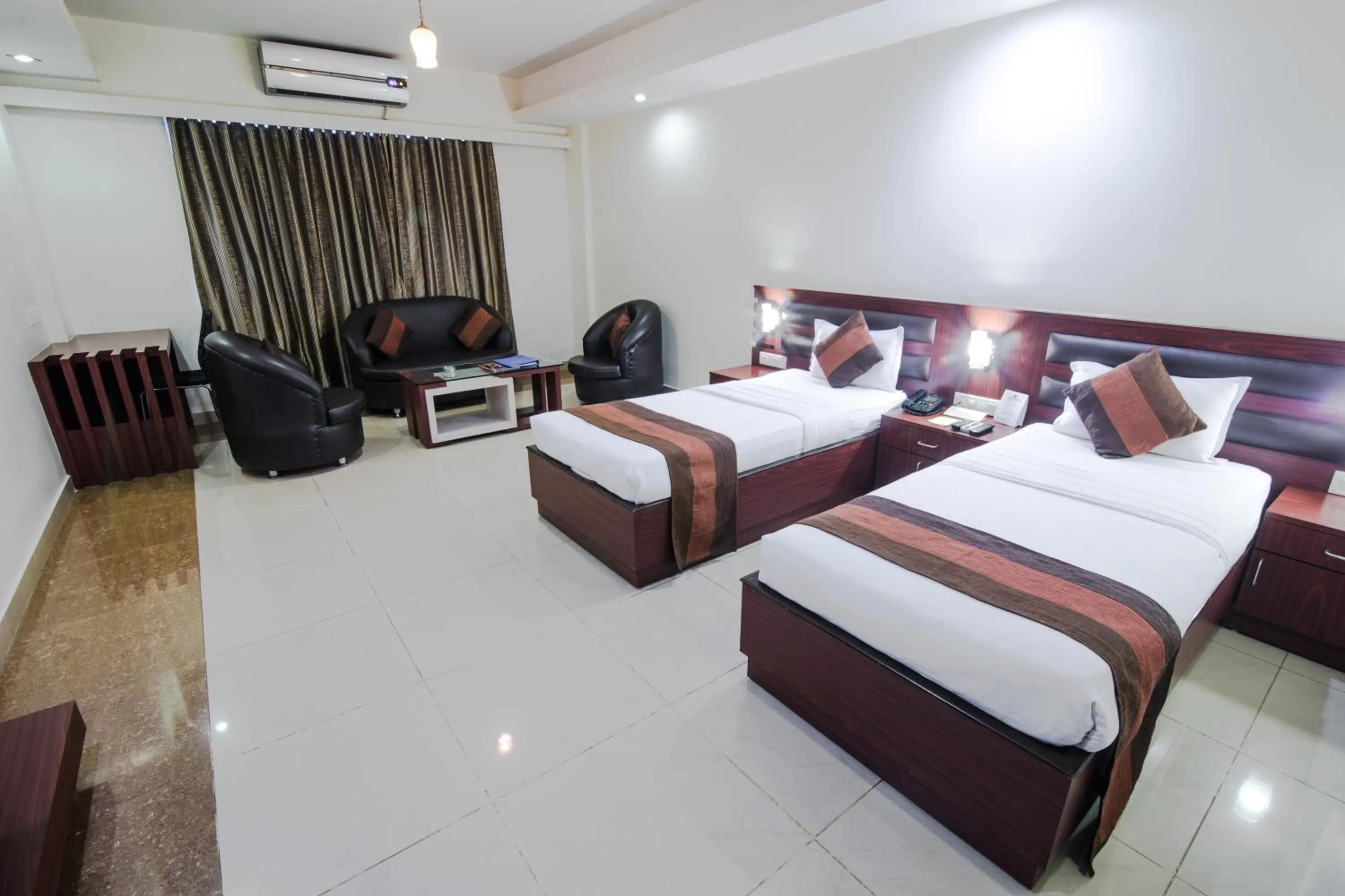 Photo of the whole room, Bed in HOTEL AVN GRAND