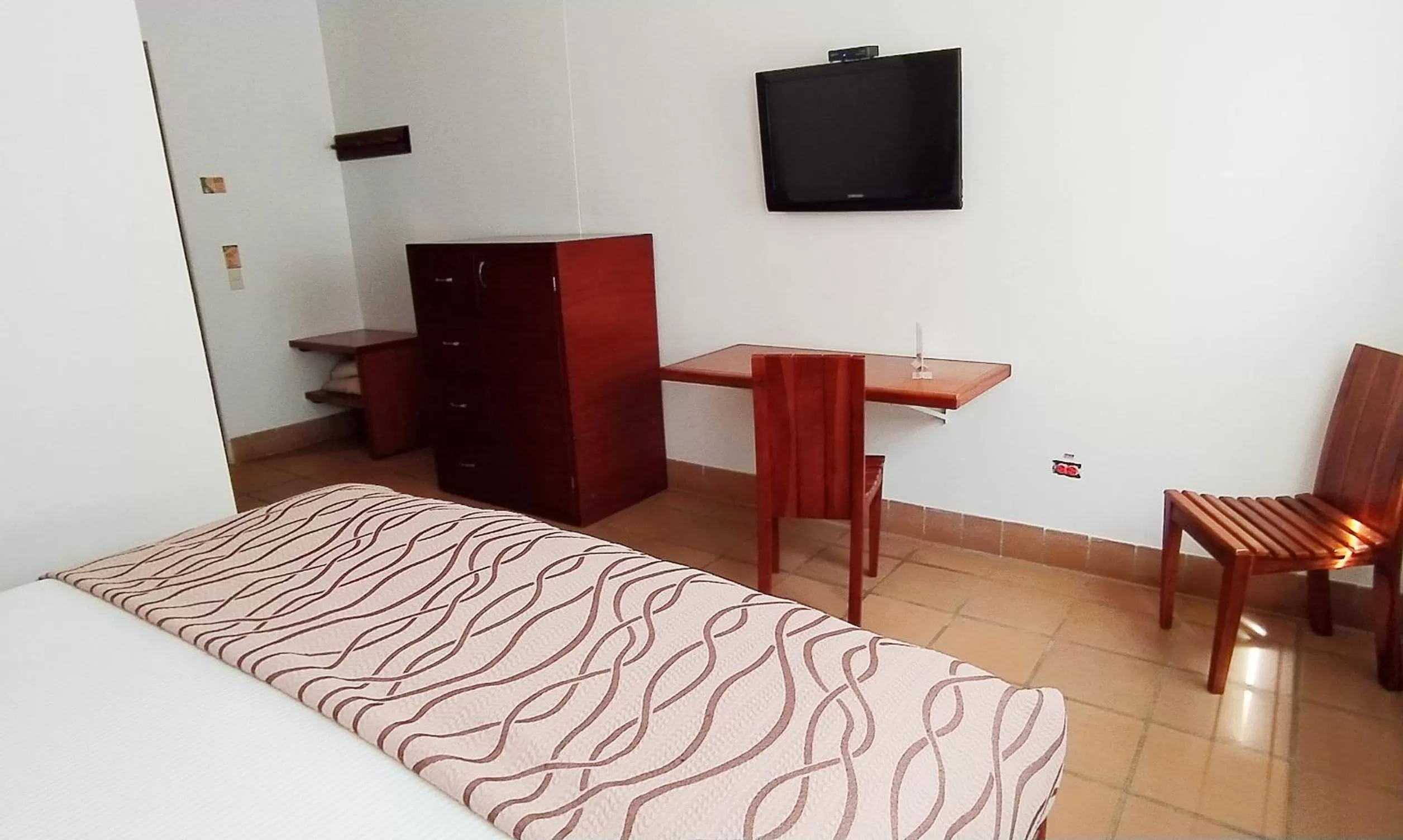 Bed in Hotel Xue Sabana