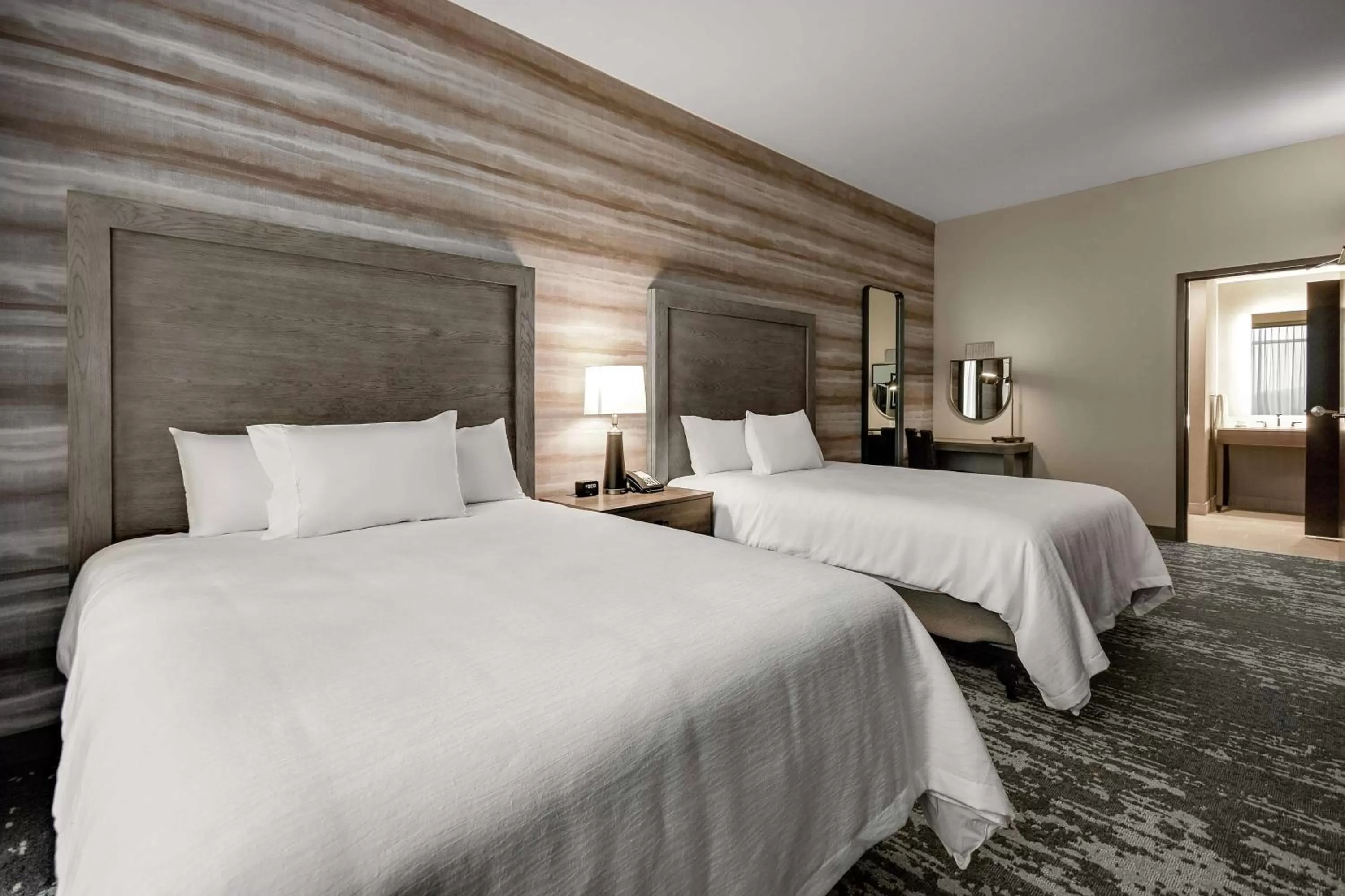 Photo of the whole room, Bed in Embassy Suites by Hilton Jonesboro Red Wolf Convention Center