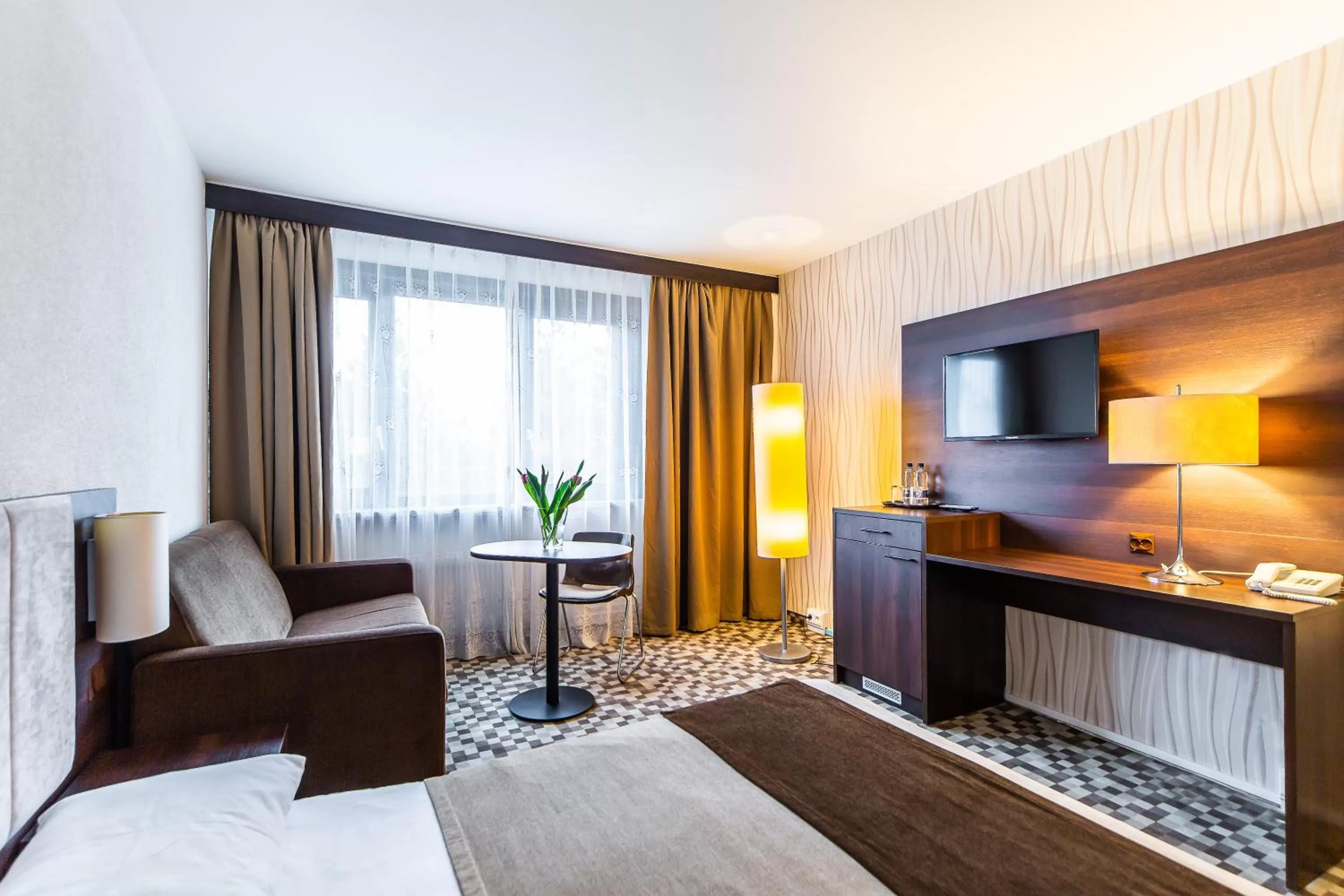 Seating area, Bed in Hotel Solny