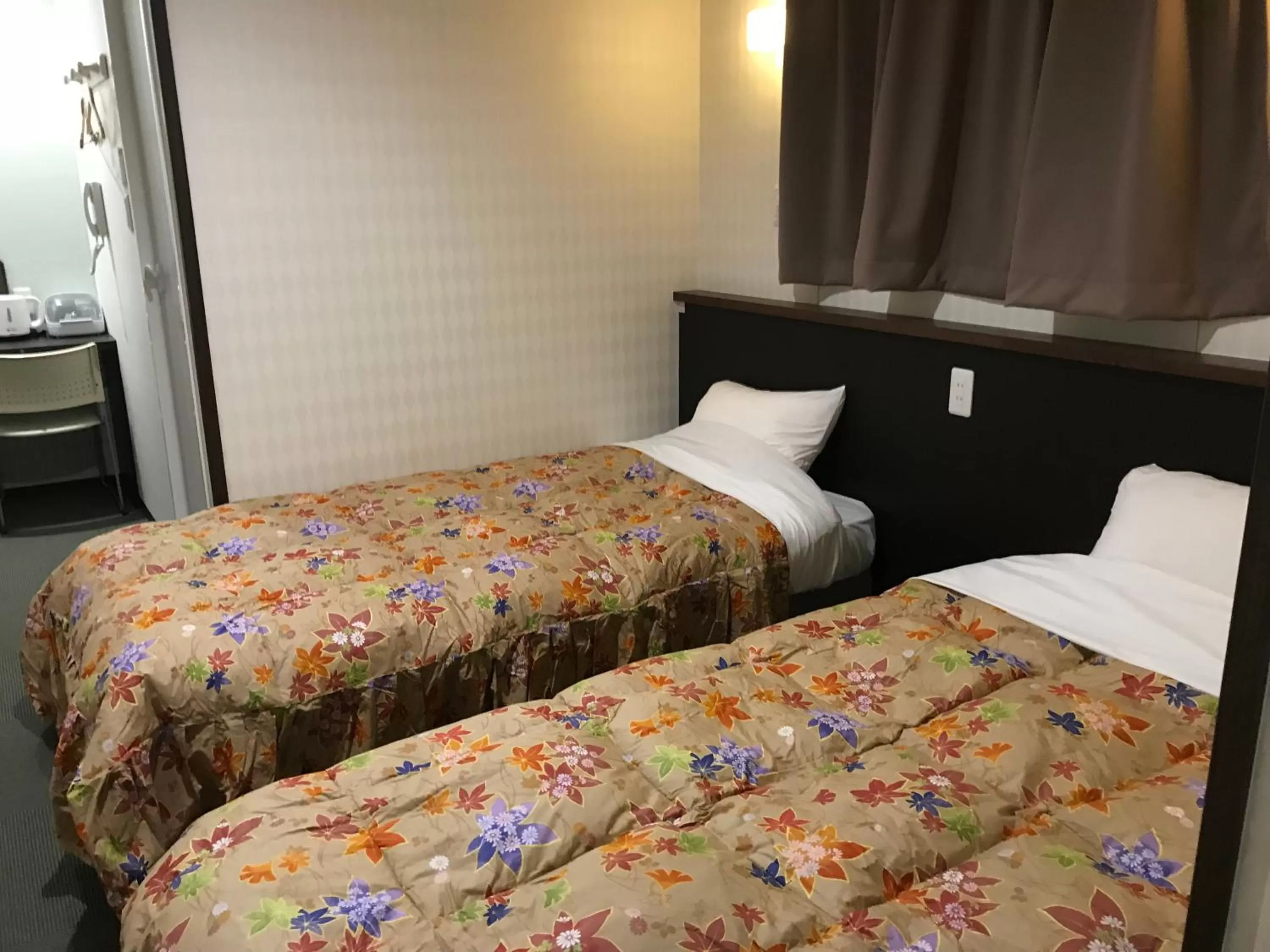 Bed in Hotel Famitic Nikko Station