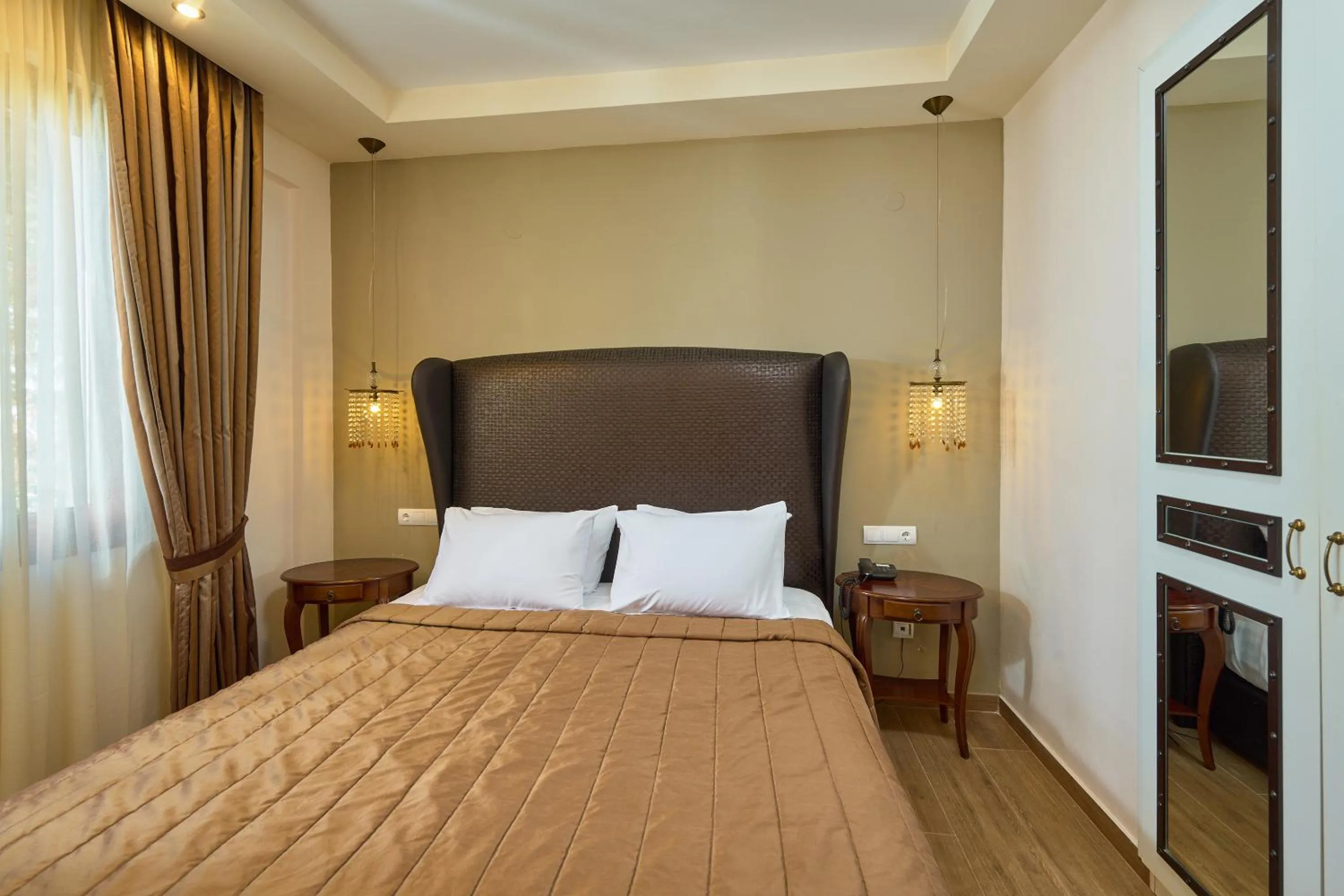 Bed in Mediterranean Village Hotel & Spa