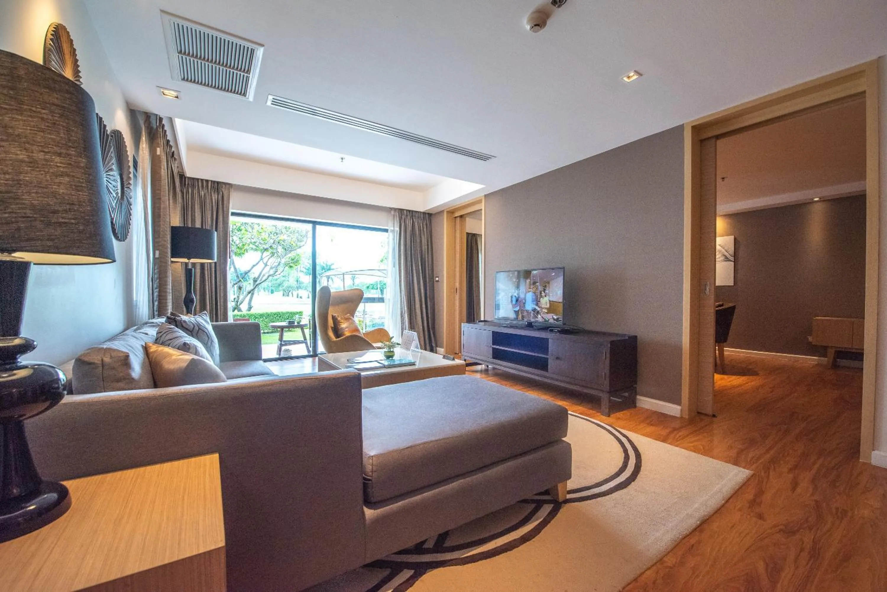 Living room in Summit Windmill Golf Suite Hotel at Suvarnabhumi