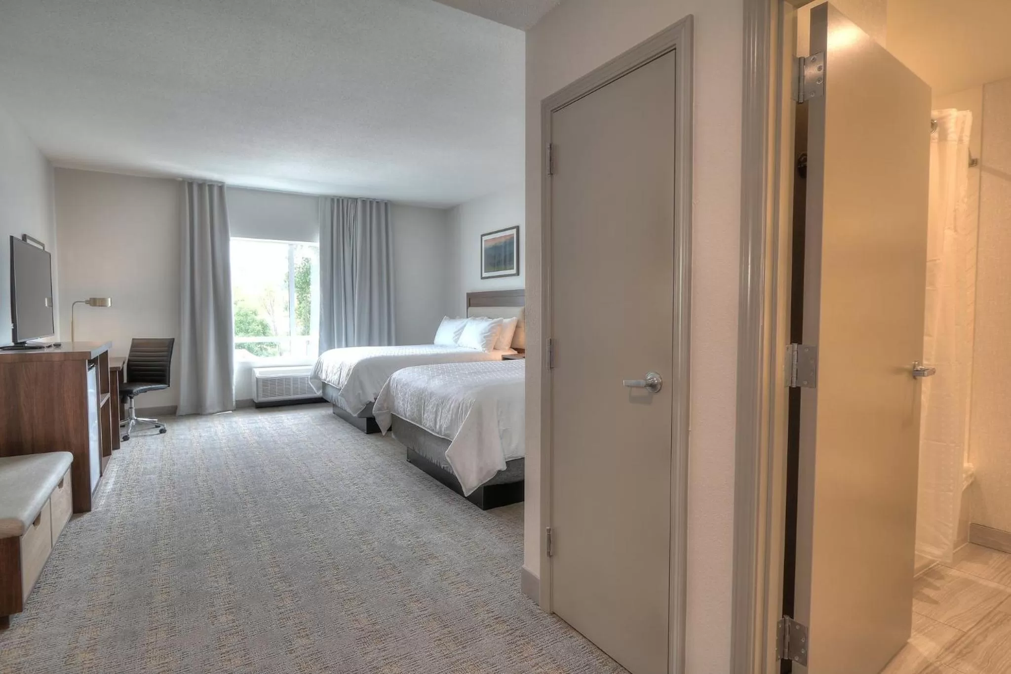 Photo of the whole room, Bed in Holiday Inn & Suites Pigeon Forge Convention Center by IHG