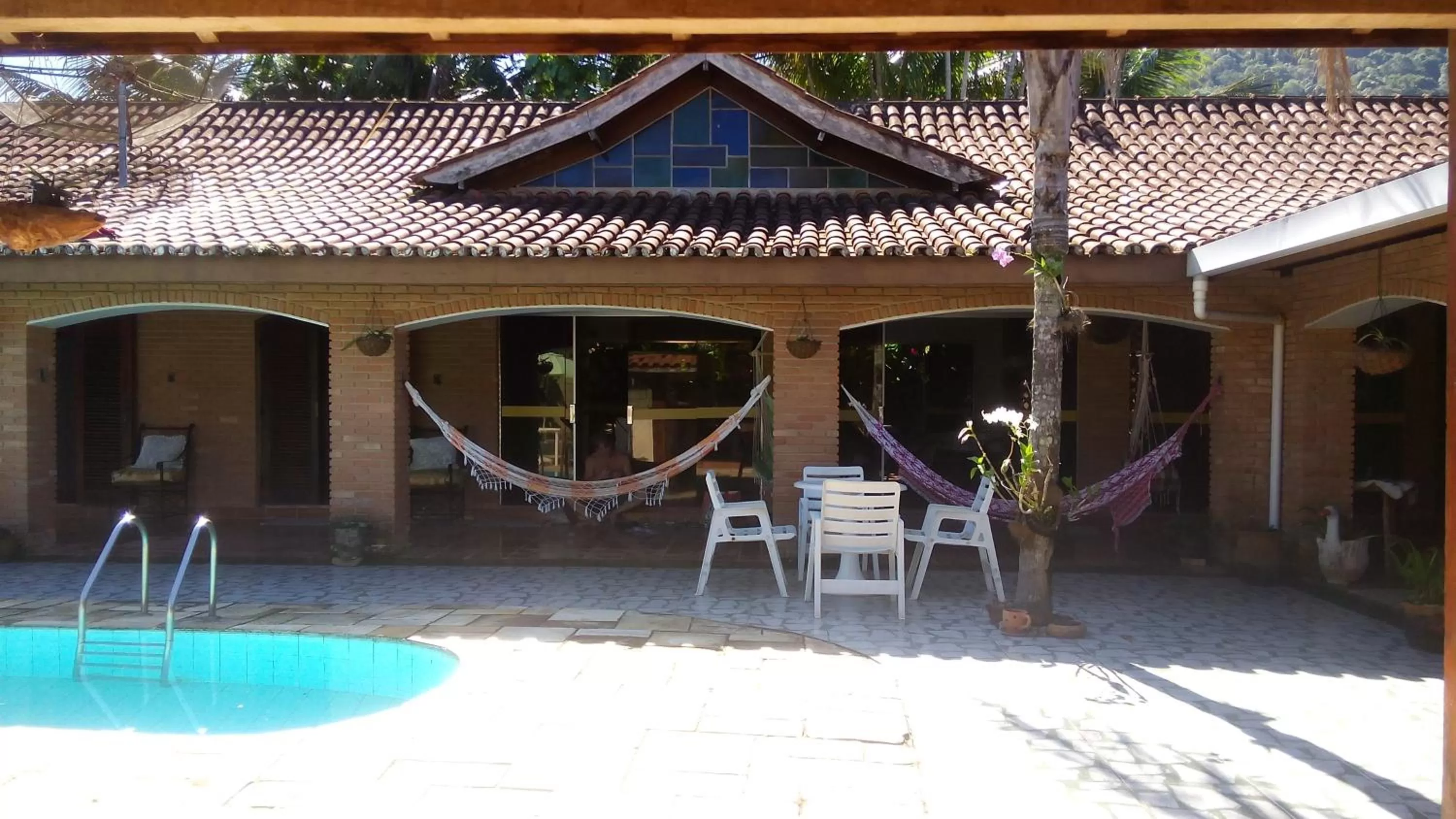 Swimming pool in Pousada Na Praia Ubatuba