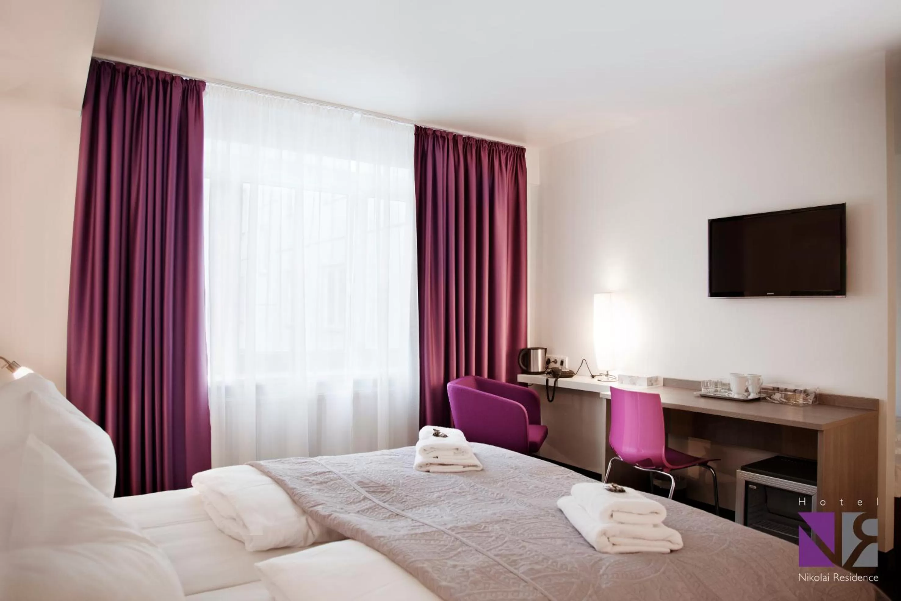 Bed in Hotel Nikolai Residence