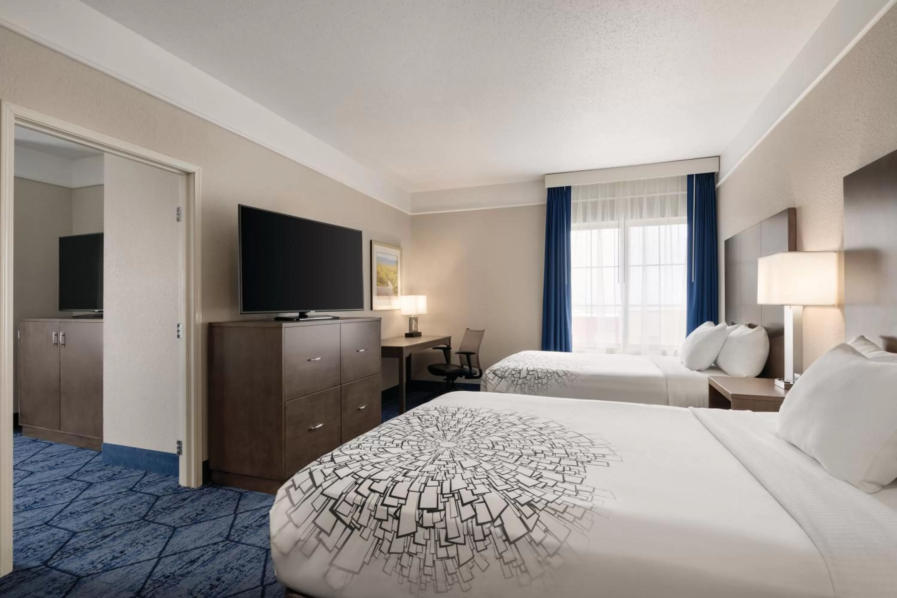 Photo of the whole room, Bed in La Quinta Inn and Suites by Wyndham at WaTiki Waterpark