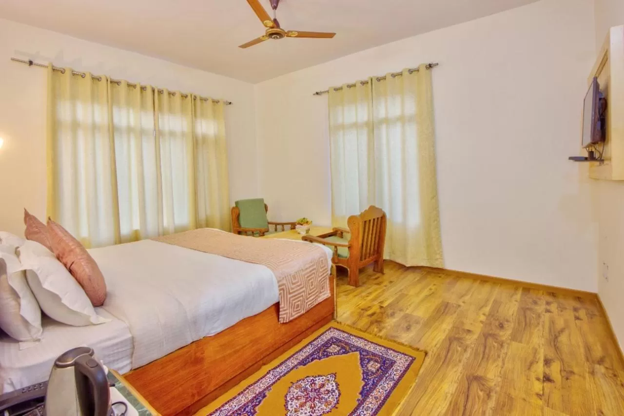 Bed in Ayushman Hotels