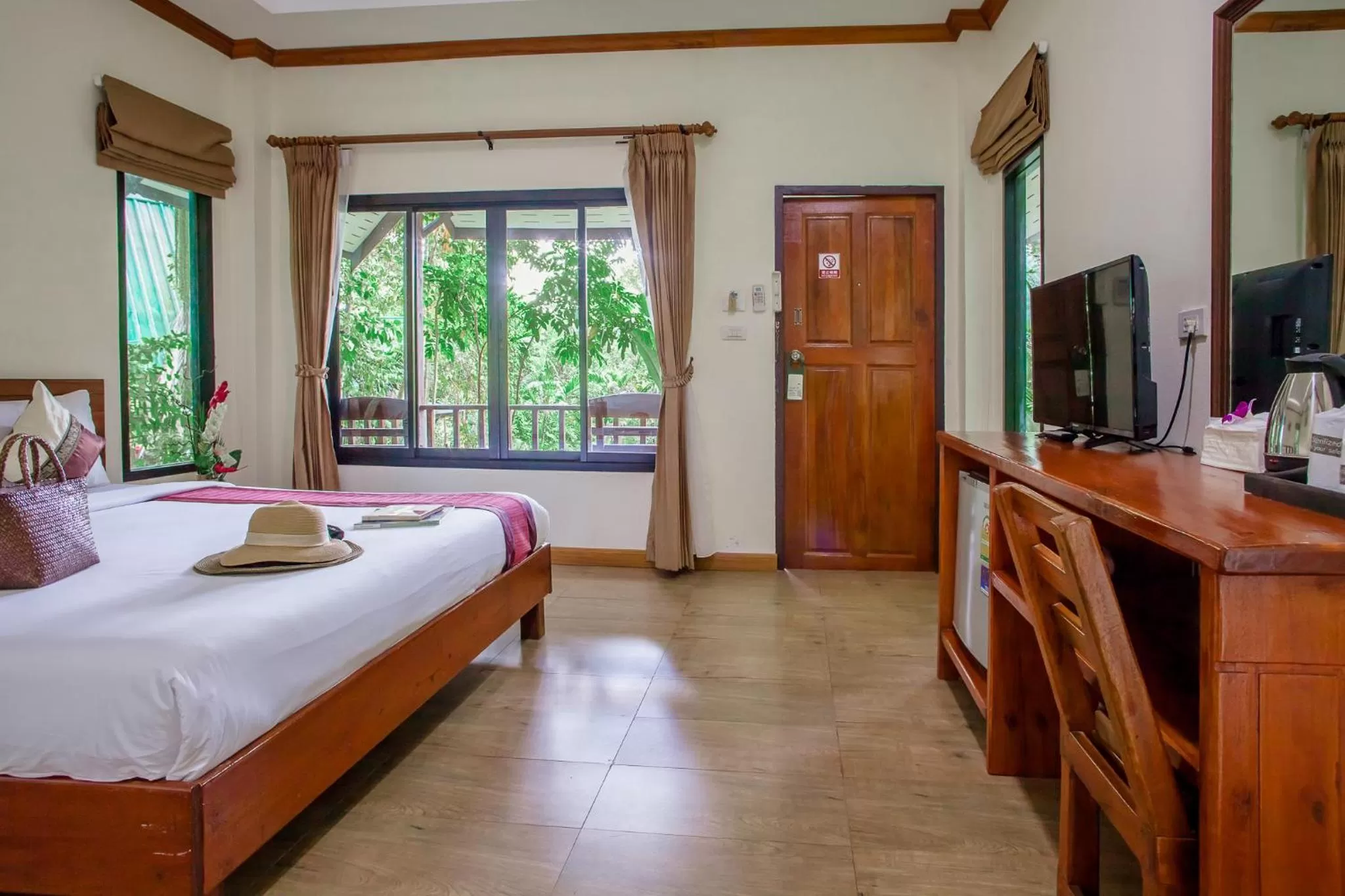 Bed in The Vatika Resort and Spa