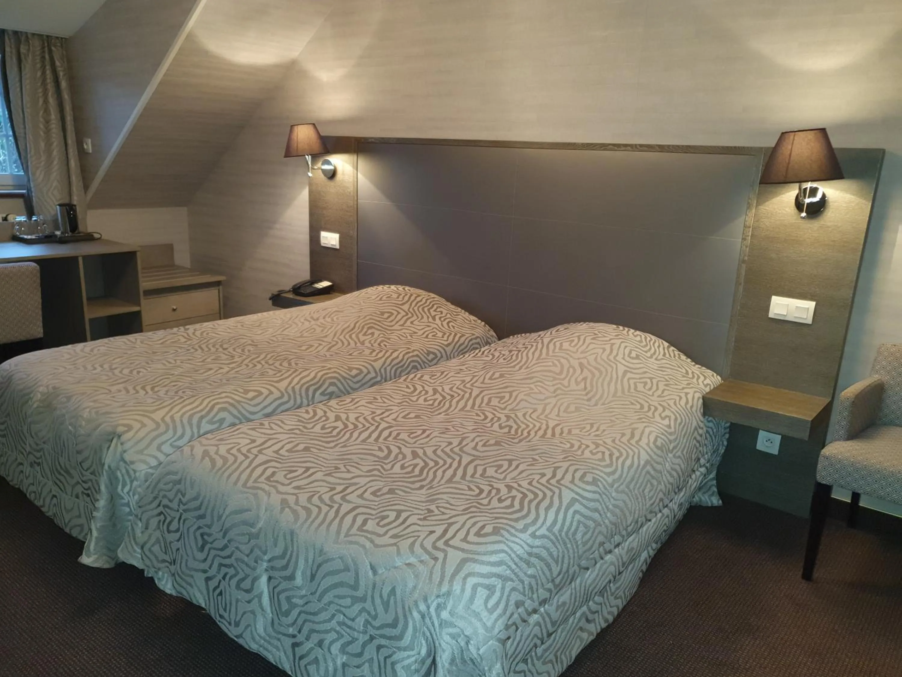 Bed in Hôtel de La Croix d'Or