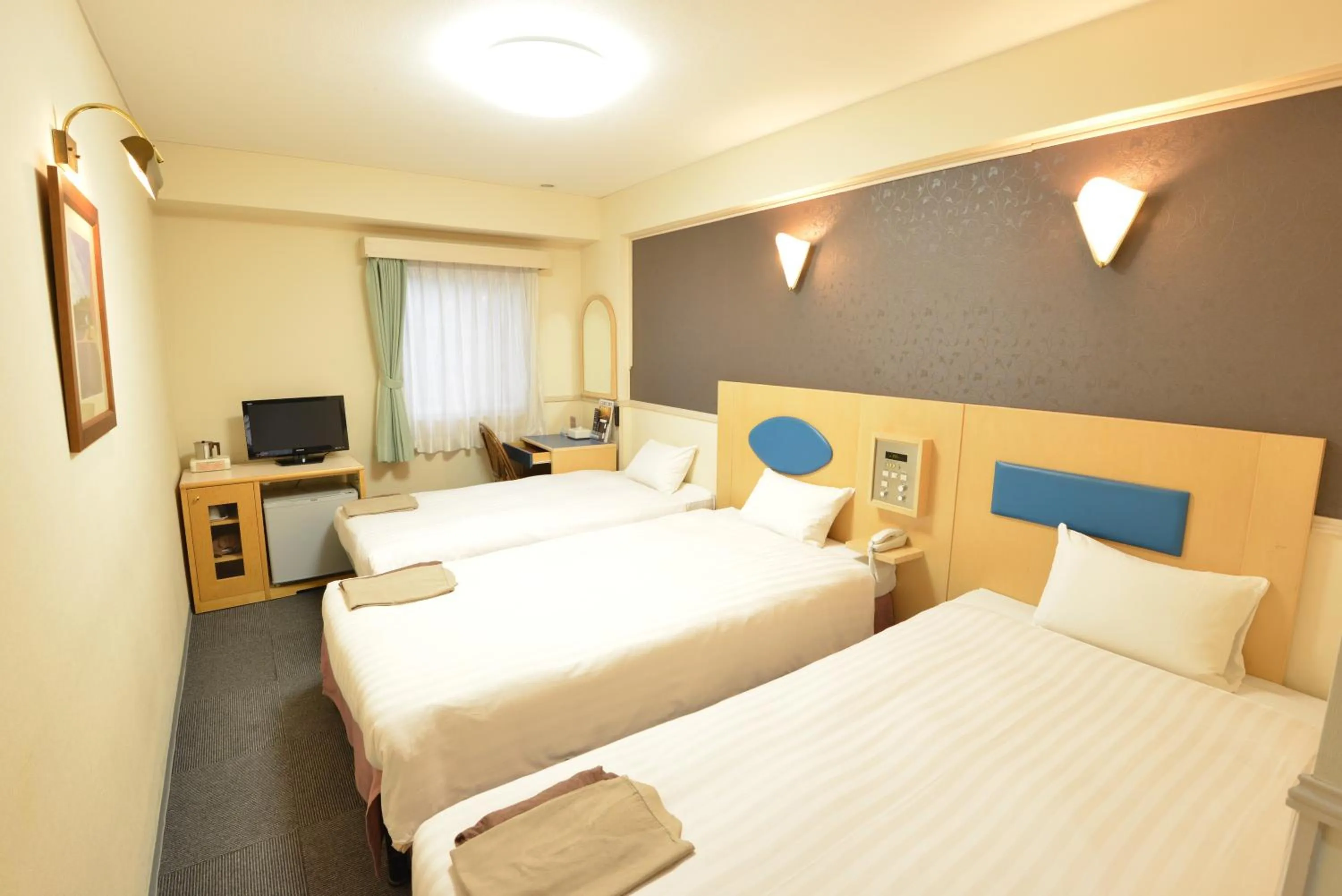 Bed in Hotel Marutani