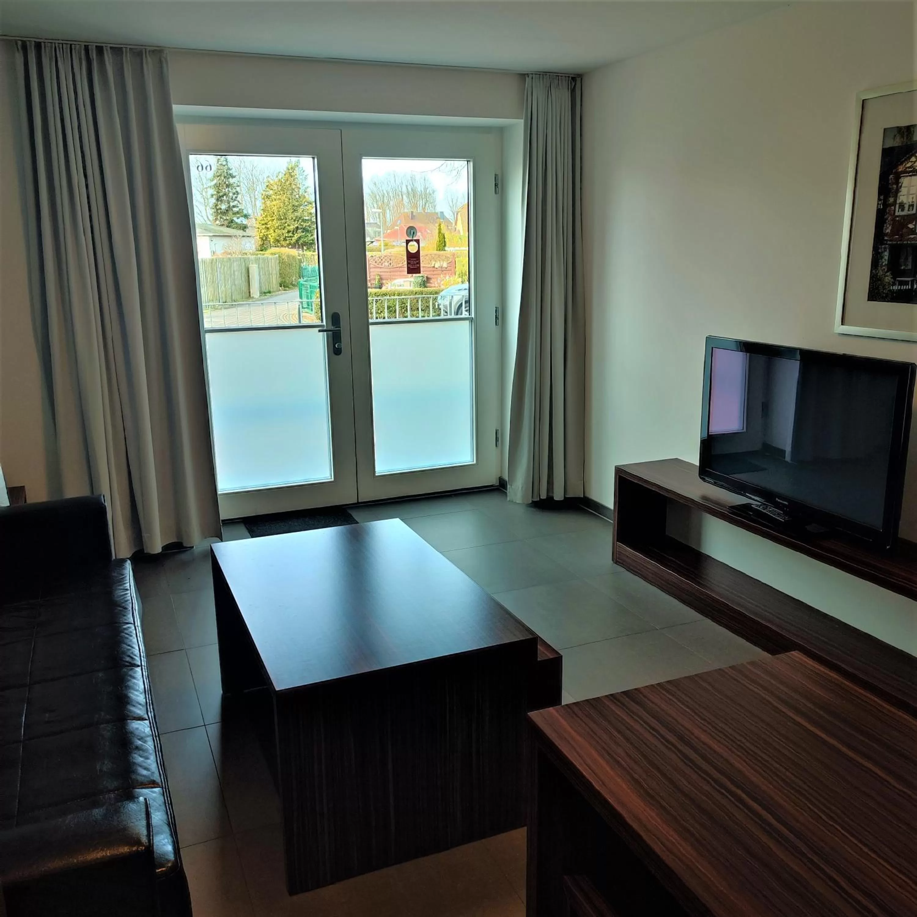 Living room, TV/Entertainment Center in Strandhotel Dranske
