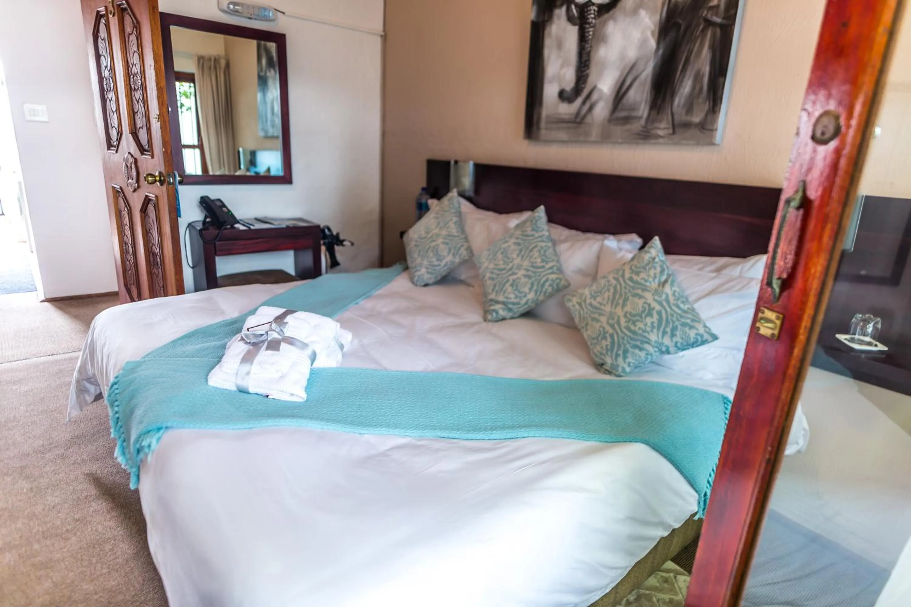 Bed in Point B Guest House -Sustainable Solar Energy