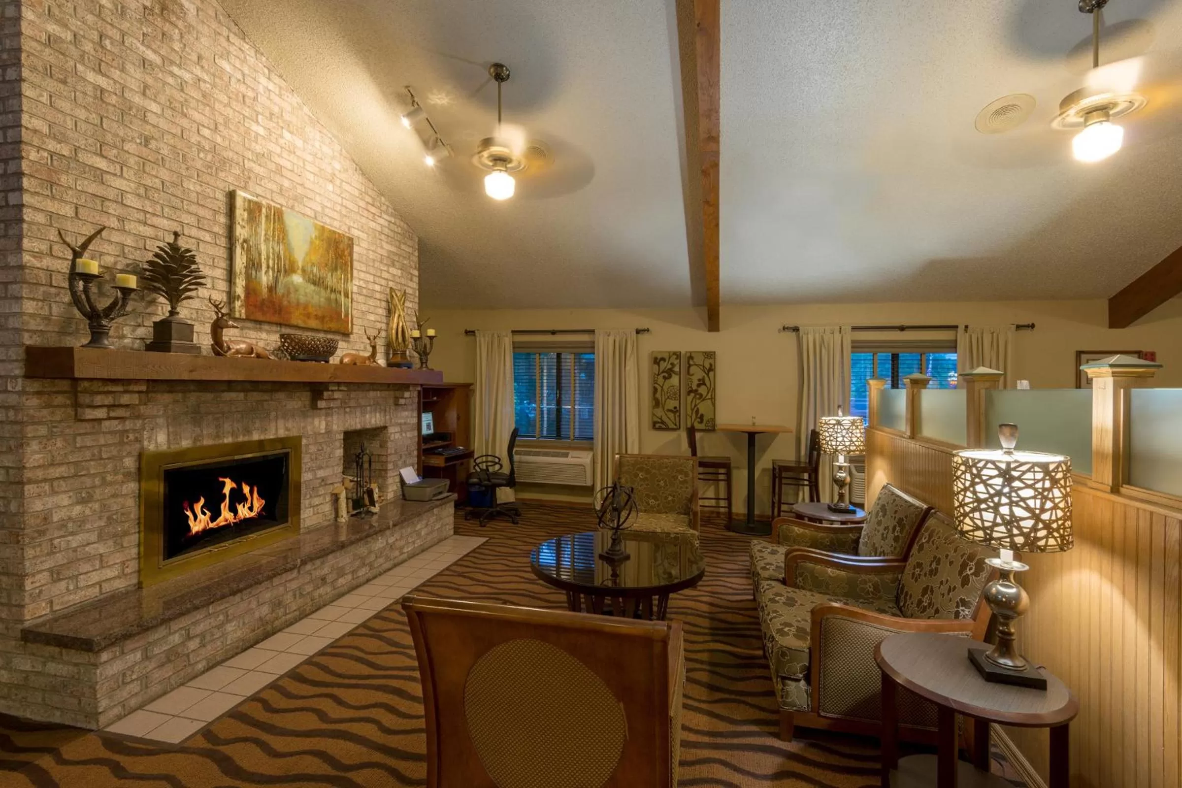 Seating area in AmericInn by Wyndham Minocqua