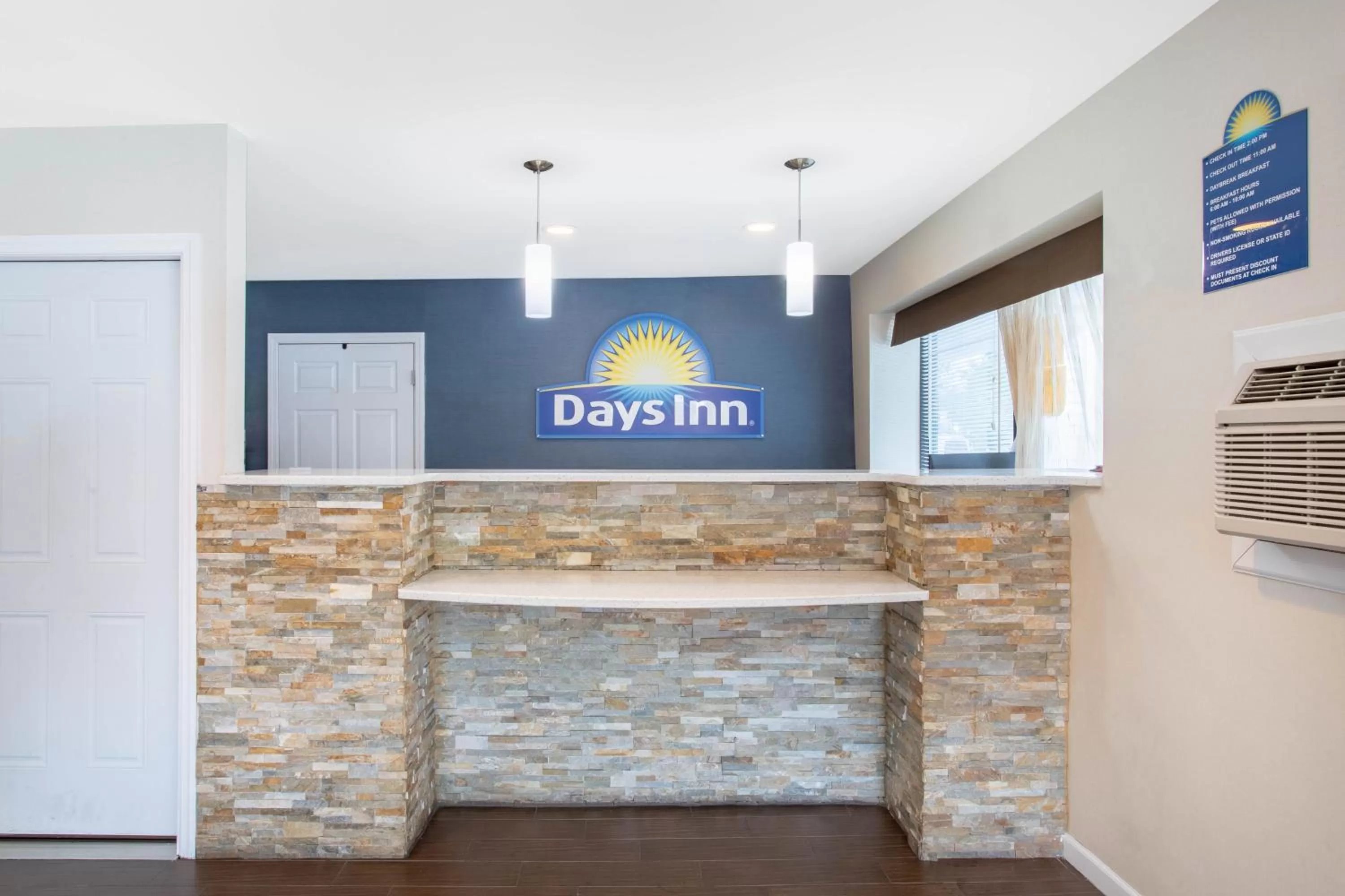 Property logo or sign in Days Inn by Wyndham Elmsford