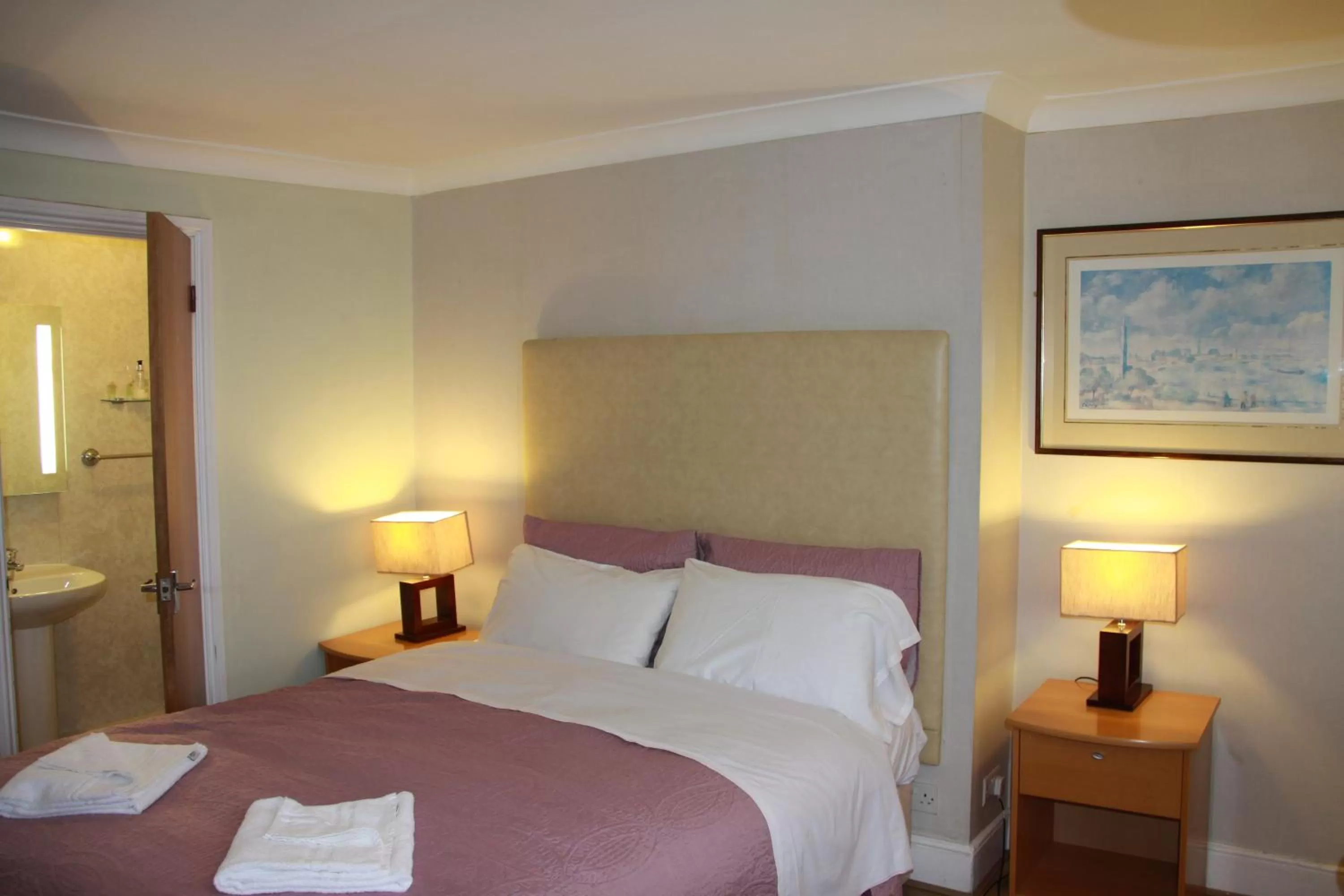 Bed in Ambassador Hotel