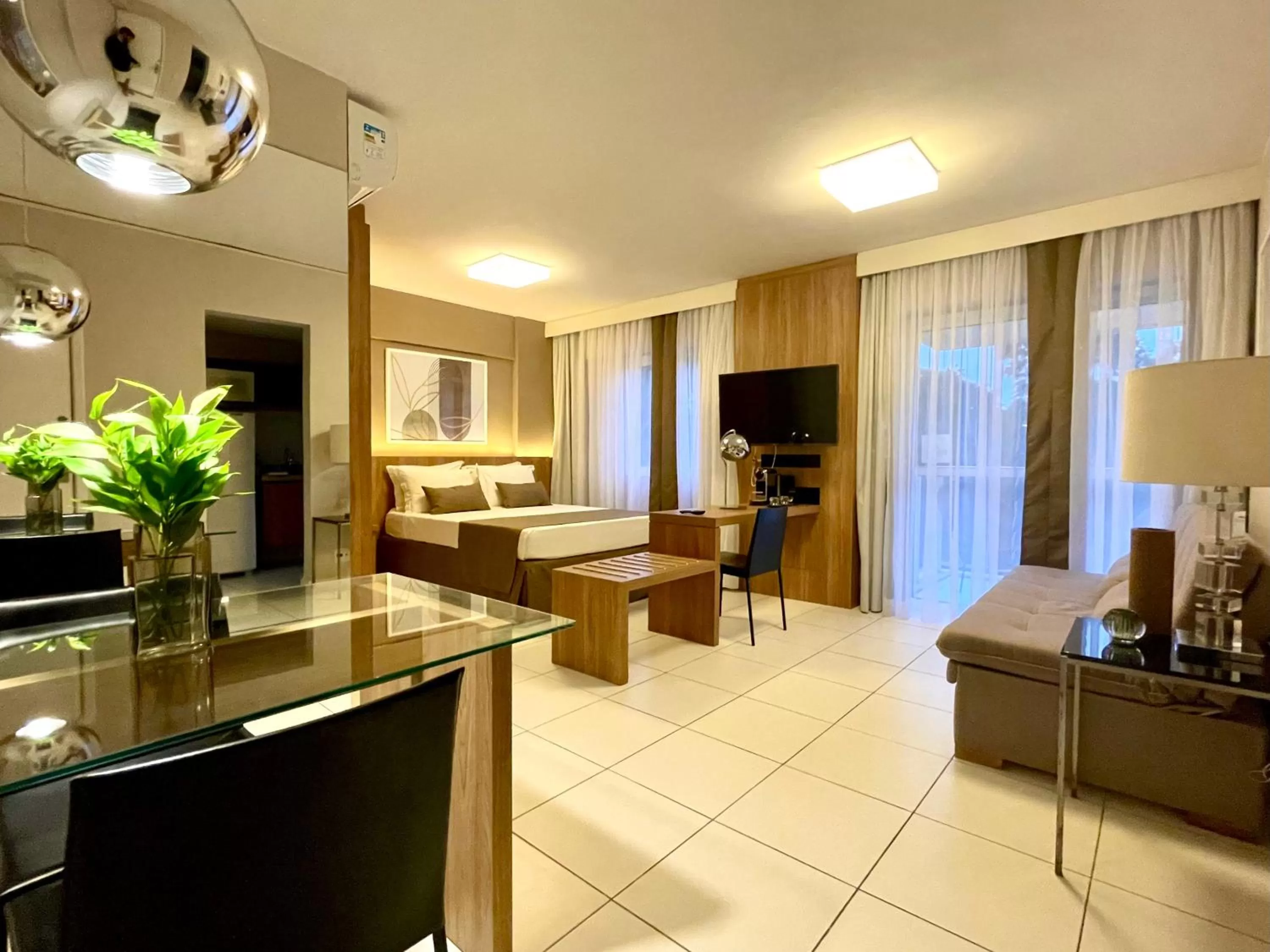 Bed, Seating Area in Suíte & Flat Premium Rio Stay - Rio Centro