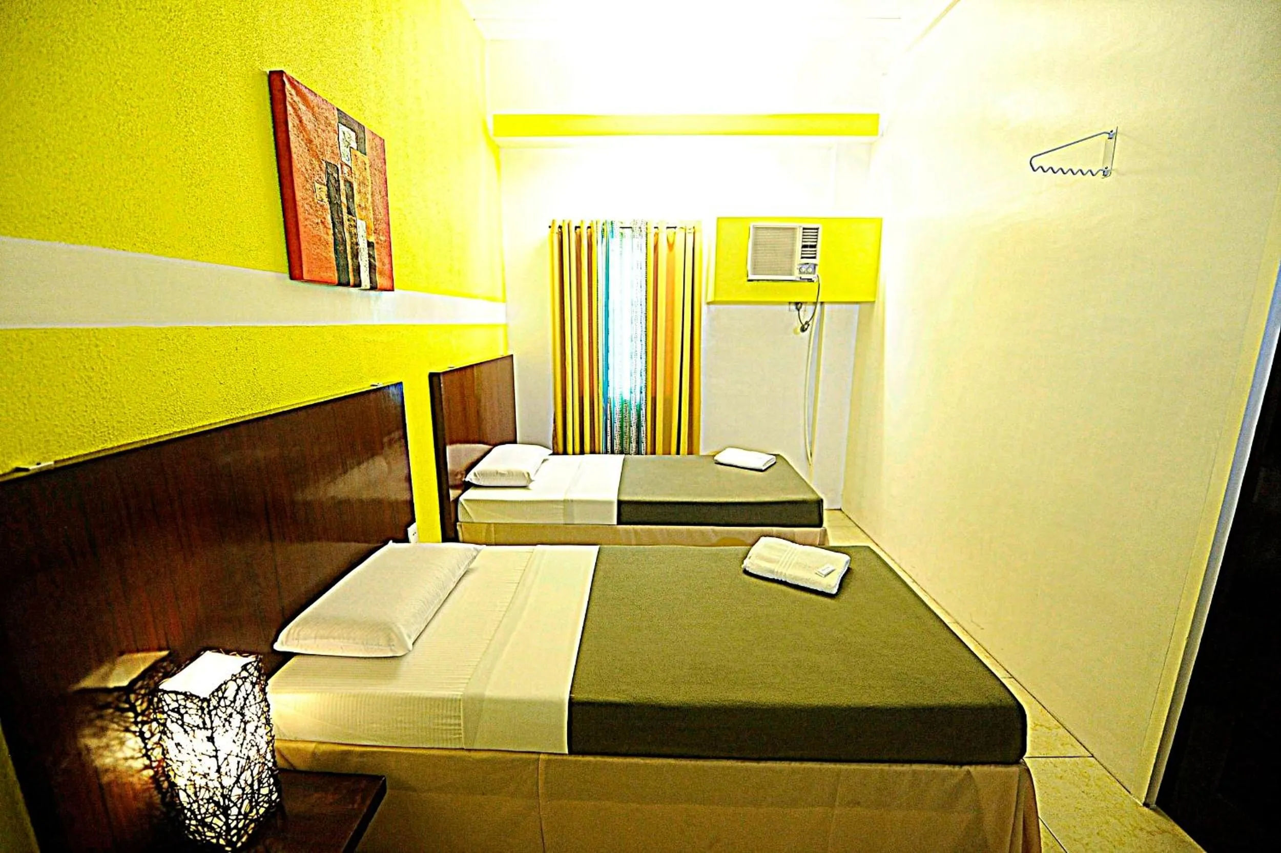 Bed in First Pacific Inn Davao