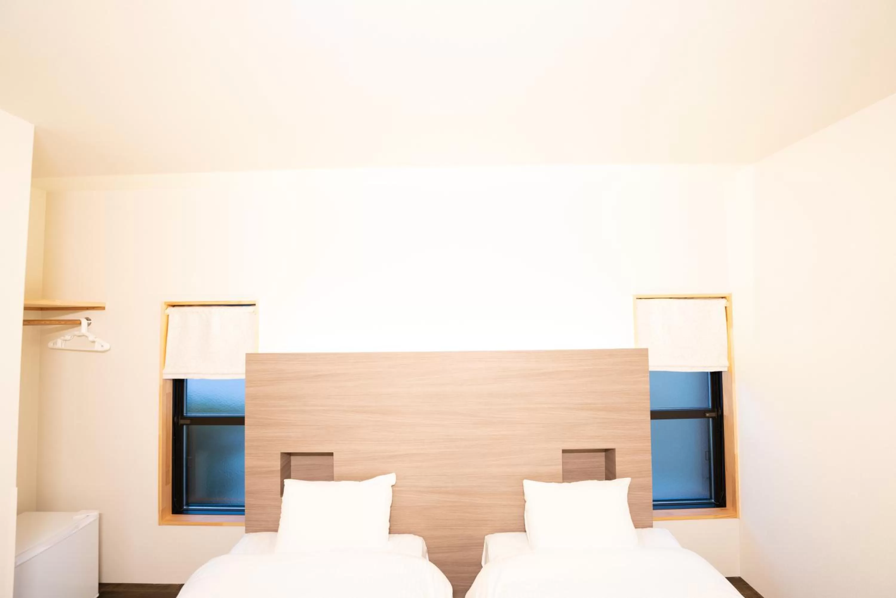 Bed in B&B MIKAWA Info Centre - Kanazawa Fish Harbour