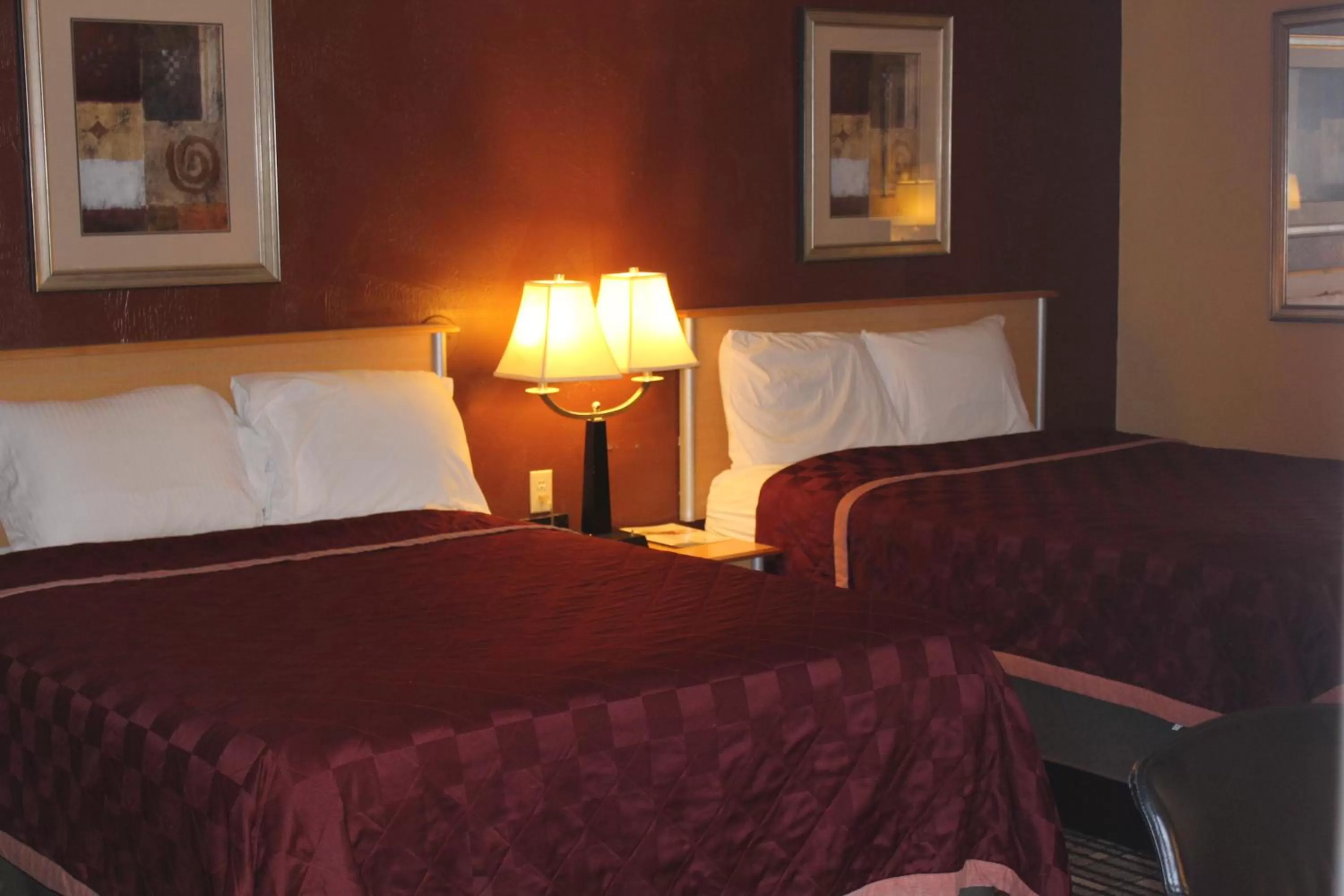 Bed in The Executive Inn & Suites